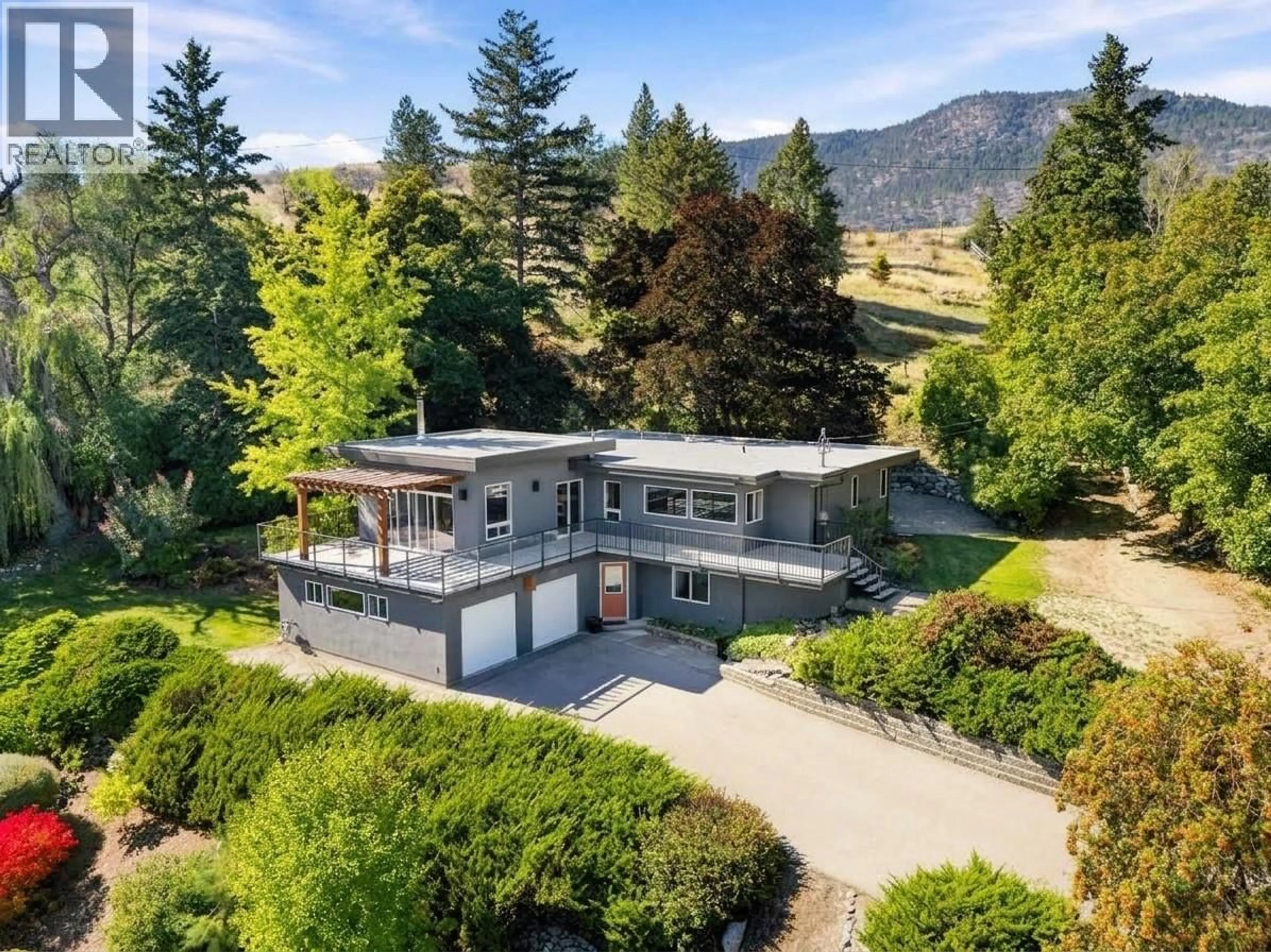 A pic from outside/outdoor area/front of a property/back of a property/a pic from drone, mountain view for 220 WEST BENCH DRIVE, Penticton British Columbia V2A8X8