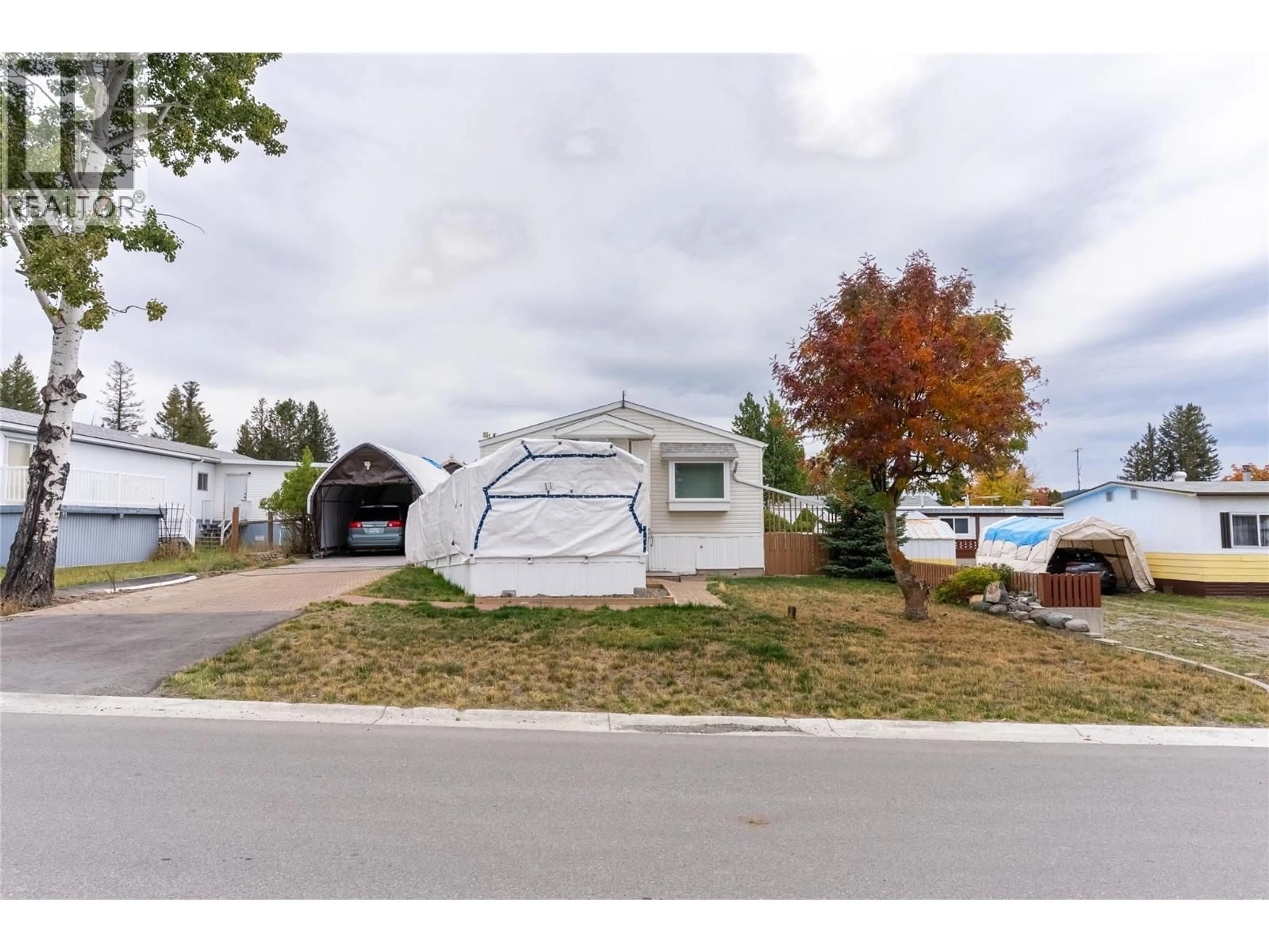Home with vinyl exterior material, street for 11 TOPAZ CRESCENT, Logan Lake British Columbia V0K1W0