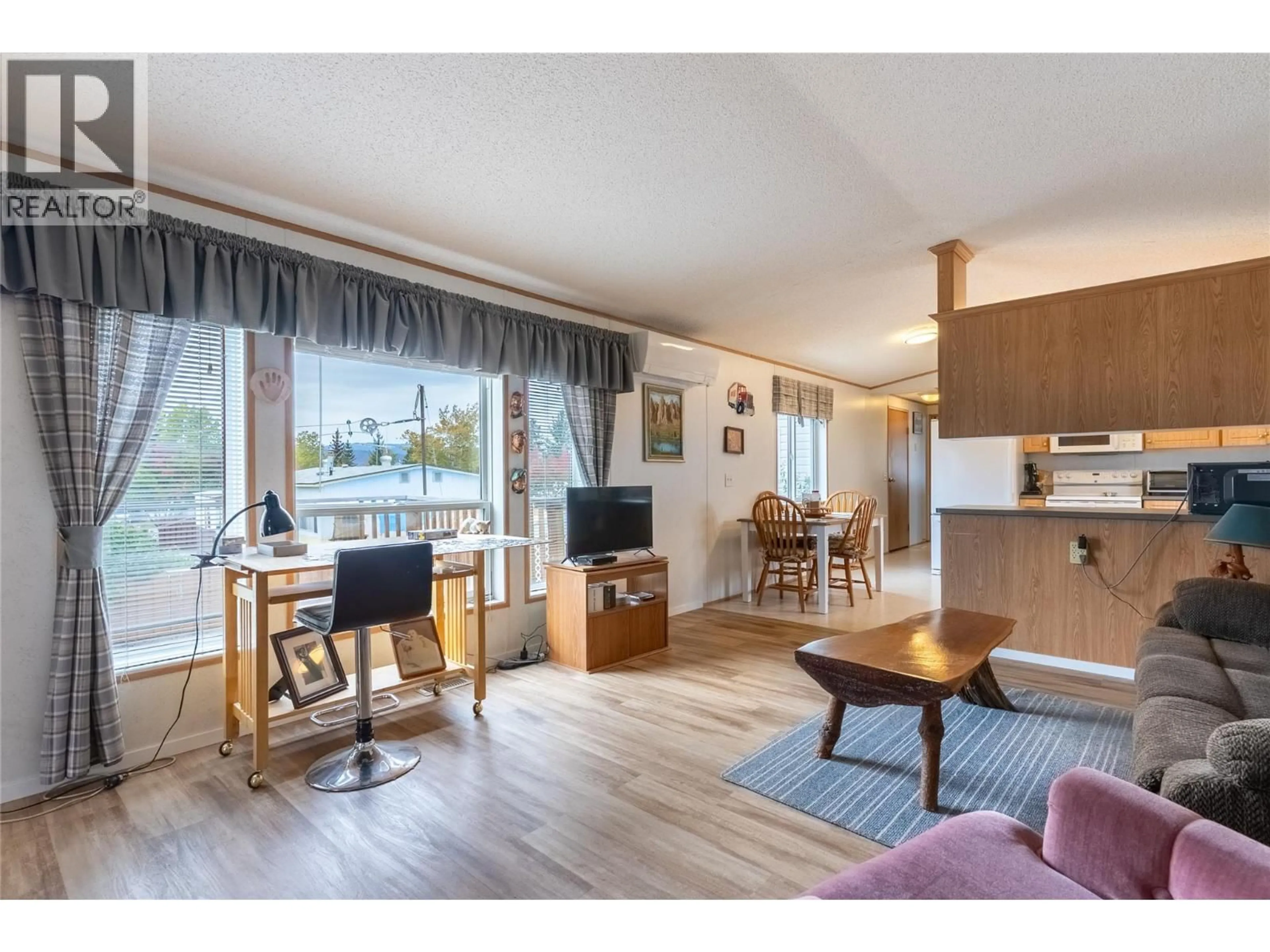 Living room with furniture, wood/laminate floor for 11 TOPAZ CRESCENT, Logan Lake British Columbia V0K1W0