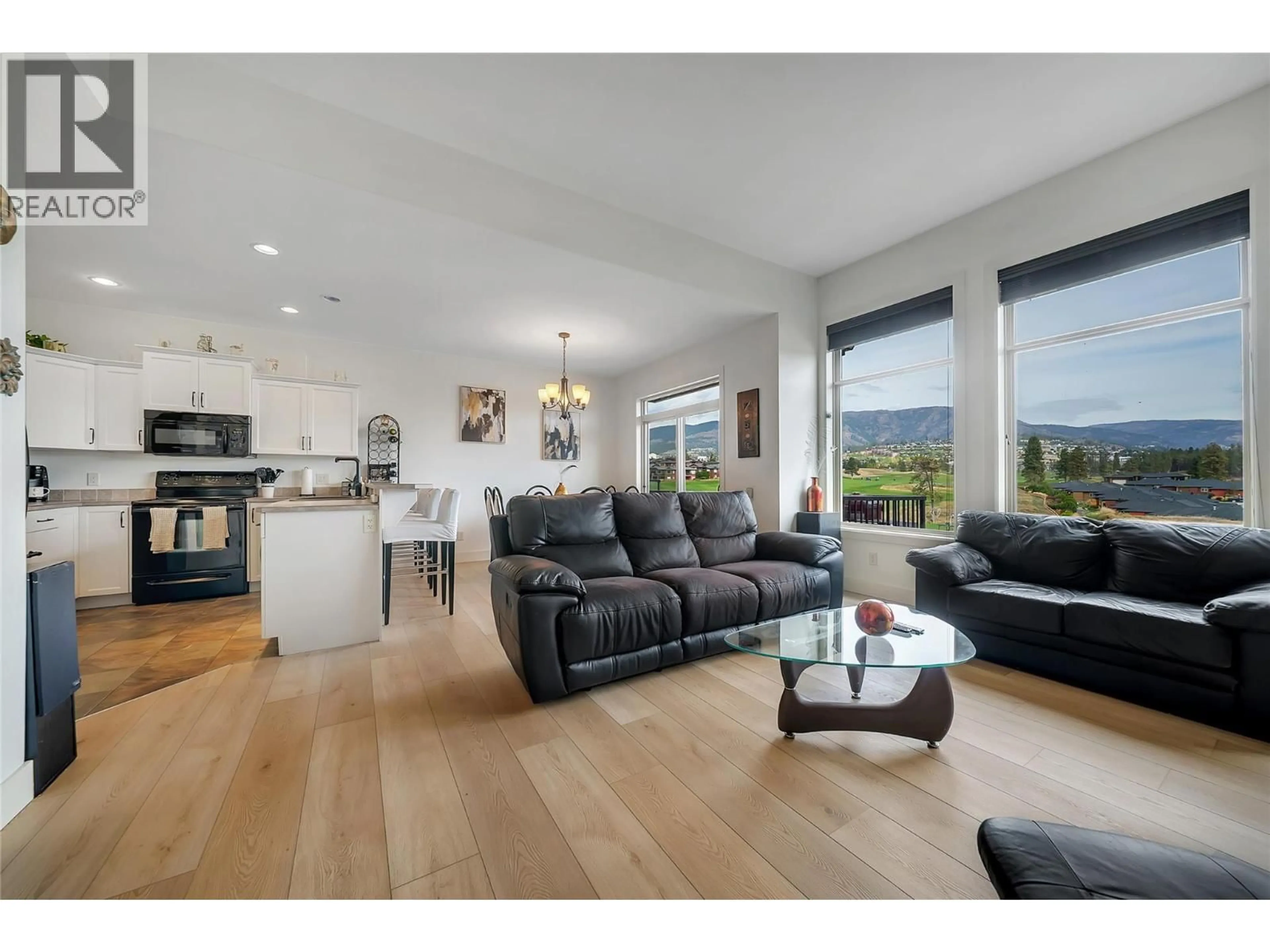 Open concept kitchen, wood/laminate floor for 2148 SERRENTO LANE, West Kelowna British Columbia V4T3G3