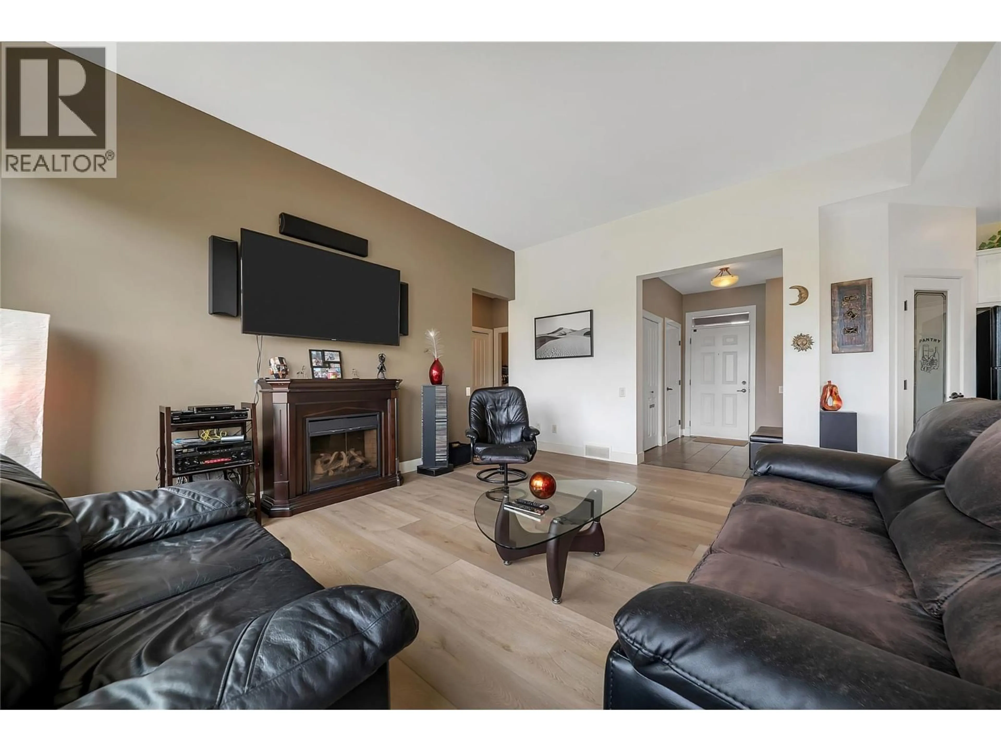 Living room with furniture, wood/laminate floor for 2148 SERRENTO LANE, West Kelowna British Columbia V4T3G3