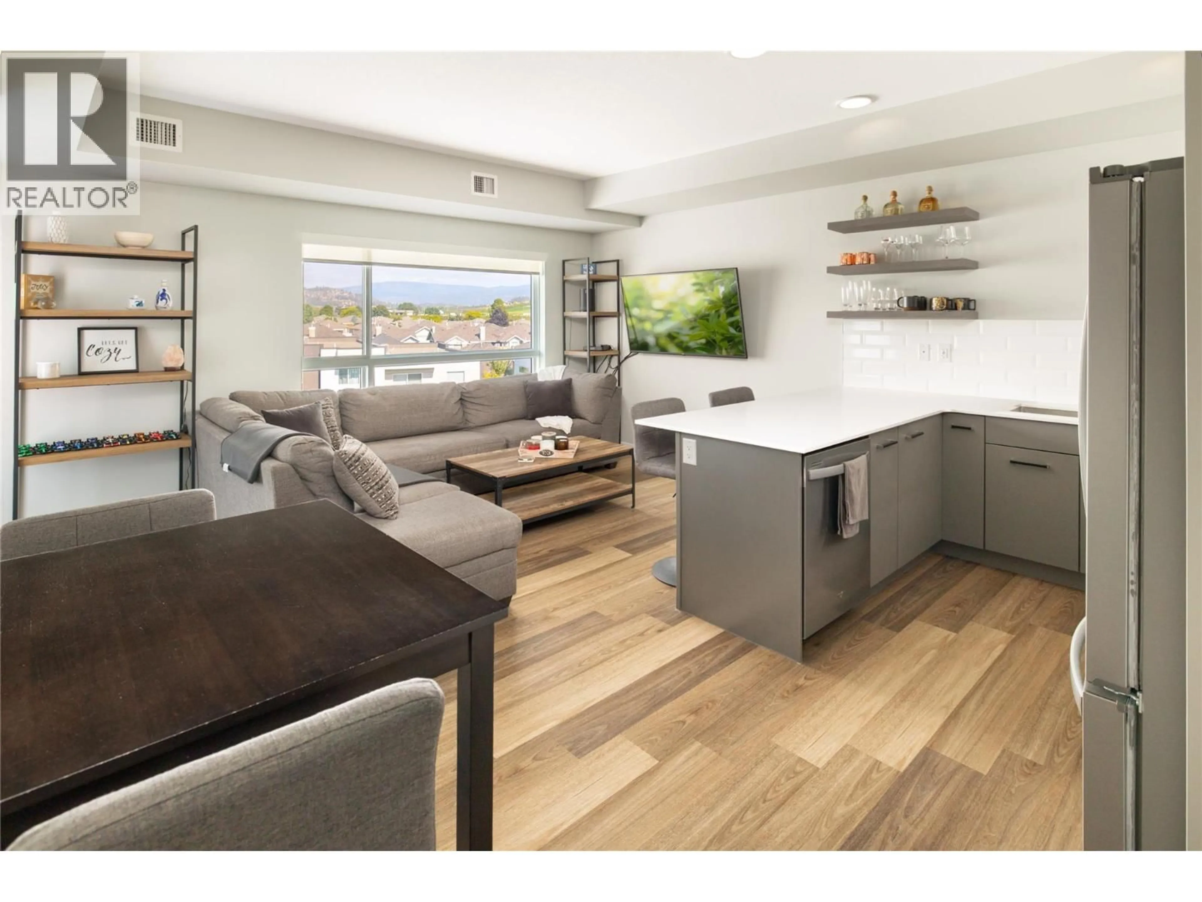 Open concept kitchen, wood/laminate floor for 402 - 722 VALLEY ROAD, Kelowna British Columbia V1V0E2