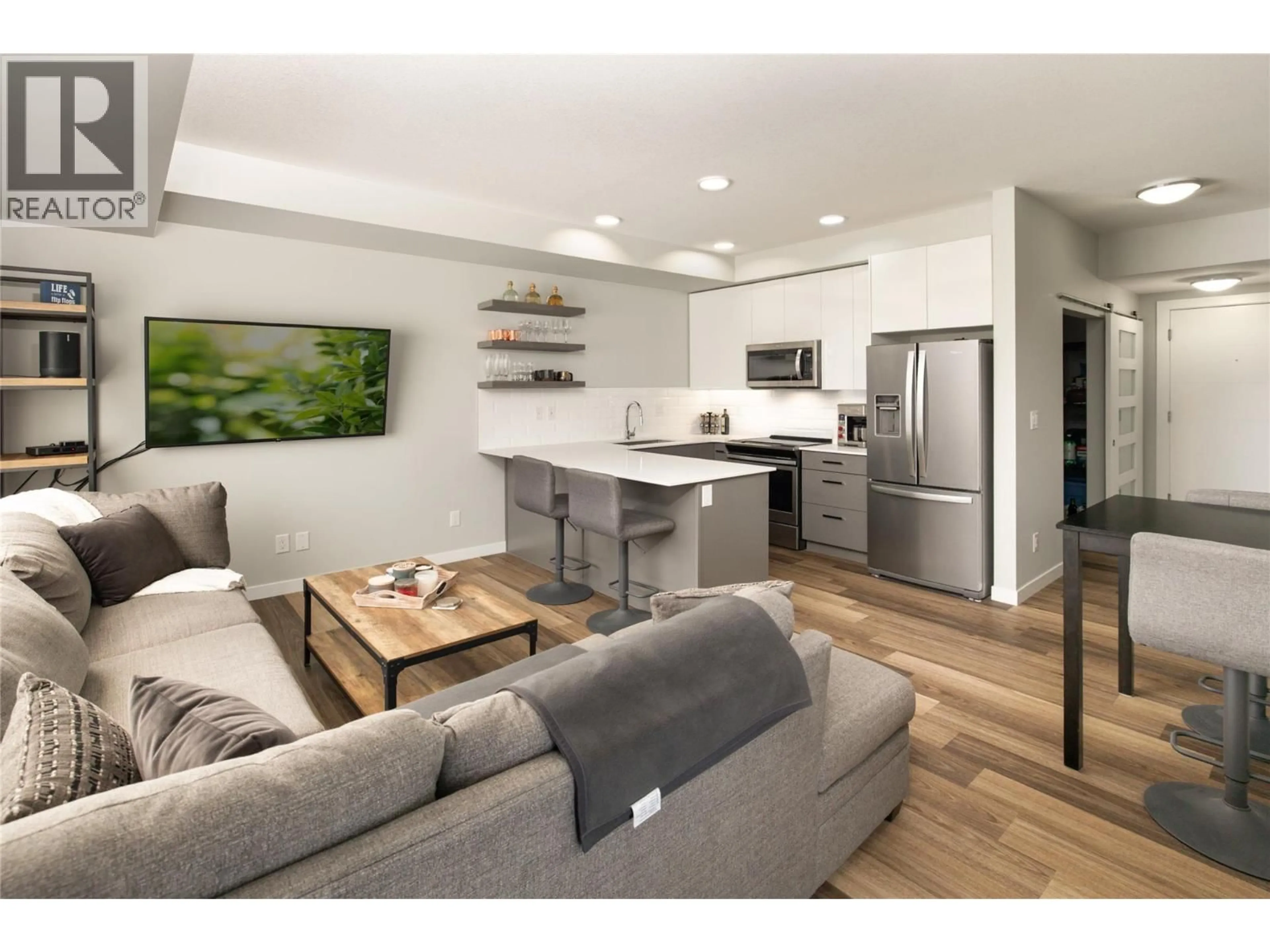 Open concept kitchen, wood/laminate floor for 402 - 722 VALLEY ROAD, Kelowna British Columbia V1V0E2