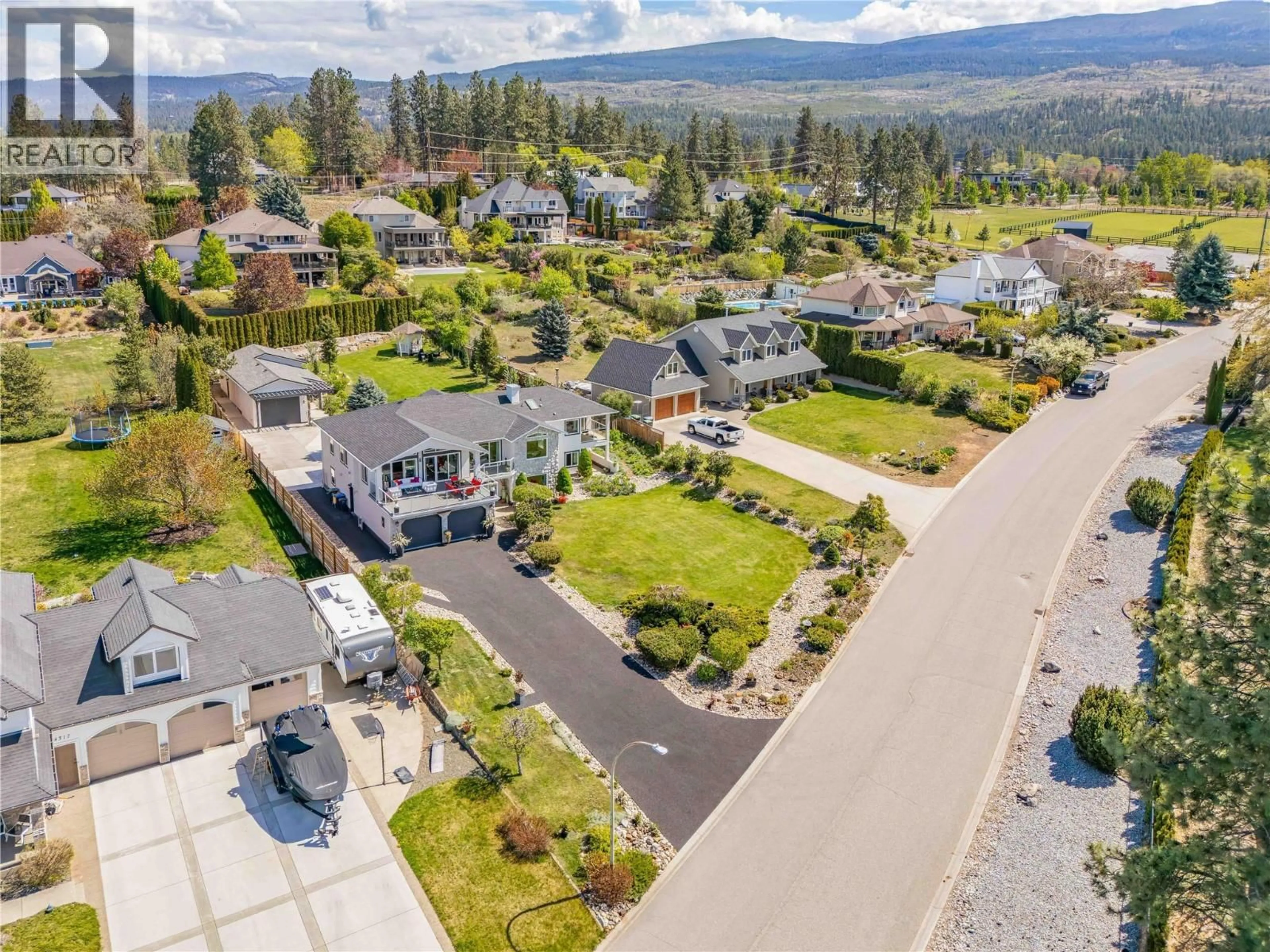 A pic from outside/outdoor area/front of a property/back of a property/a pic from drone, mountain view for 4325 TAKLA ROAD, Kelowna British Columbia V1W3C4