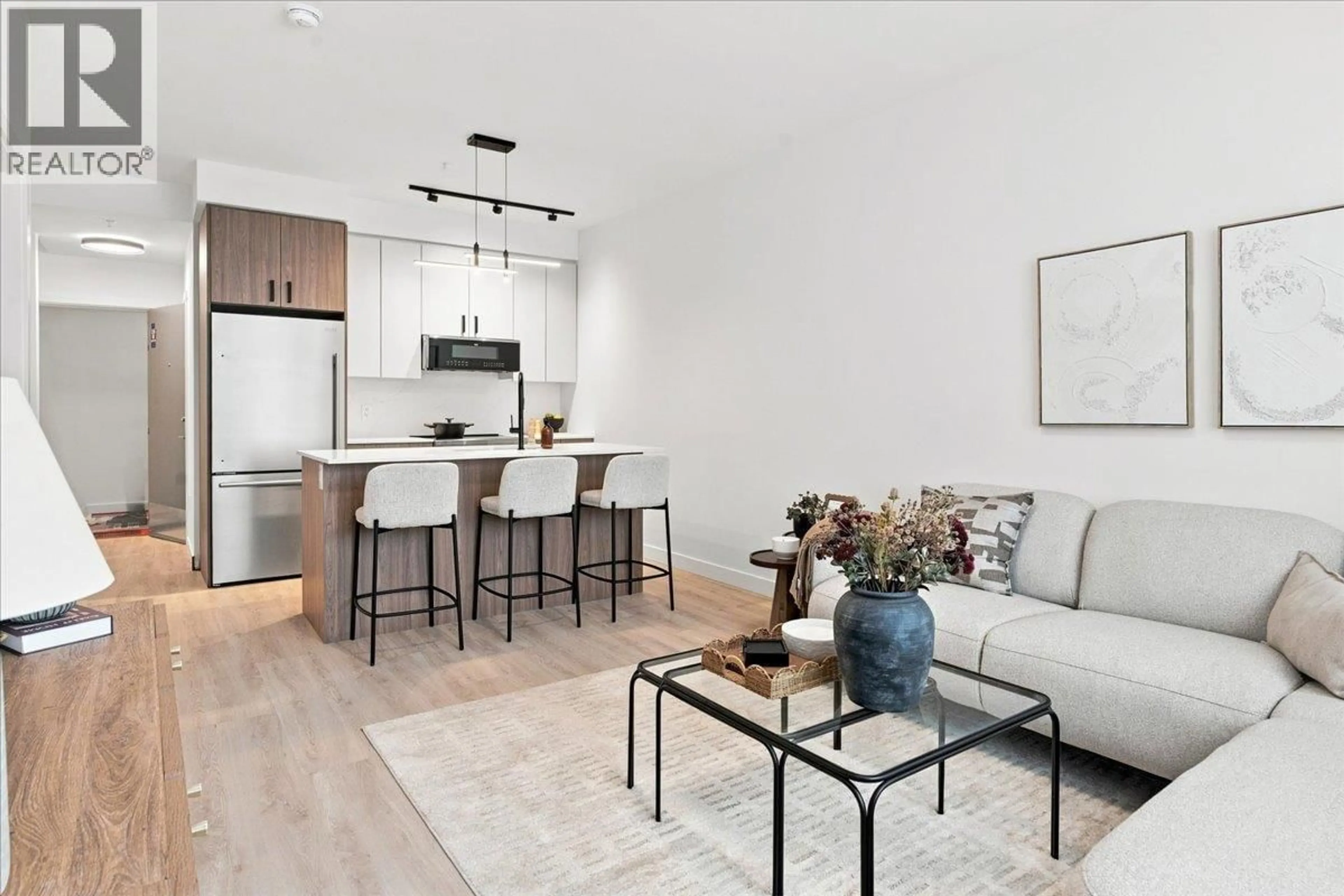 Living room with furniture, wood/laminate floor for 206 - 1655 ABERDEEN DRIVE, Kamloops British Columbia V1S0C6