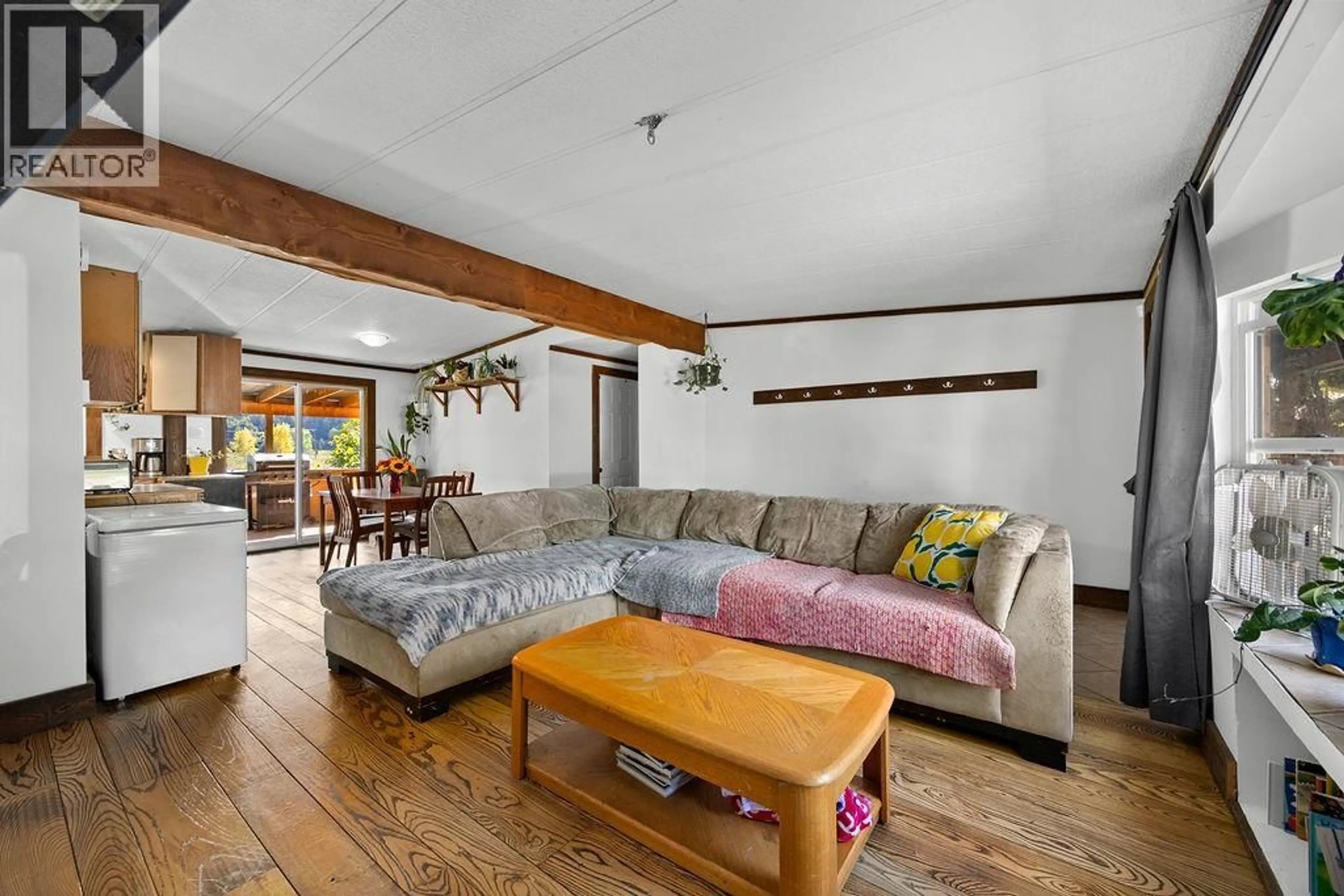 Living room with furniture, wood/laminate floor for 18 - 3495 ADAIR STREET, Armstrong British Columbia V4Y0J6