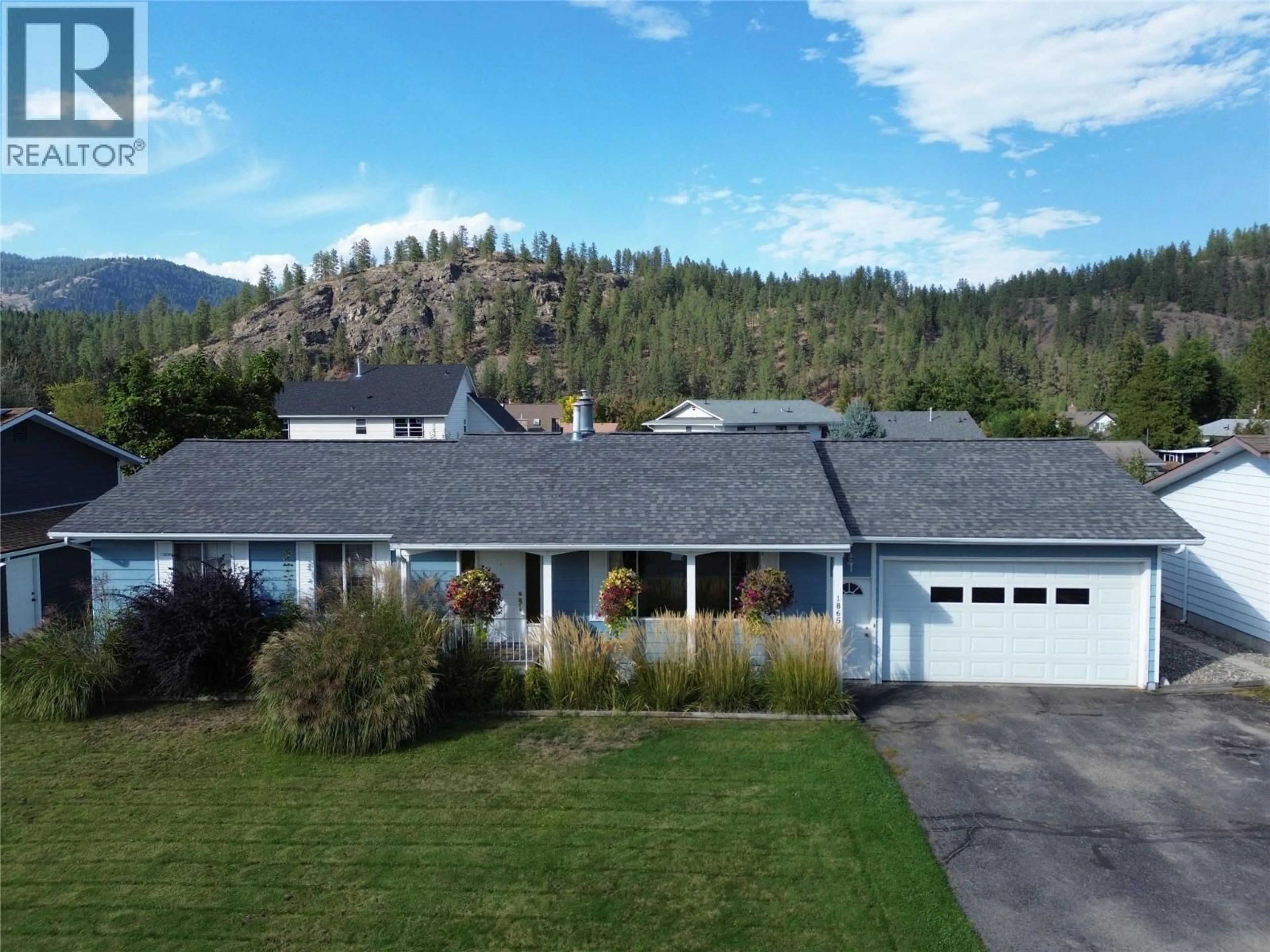 A pic from outside/outdoor area/front of a property/back of a property/a pic from drone, mountain view for 1865 78TH AVENUE, Grand Forks British Columbia V0H1H2