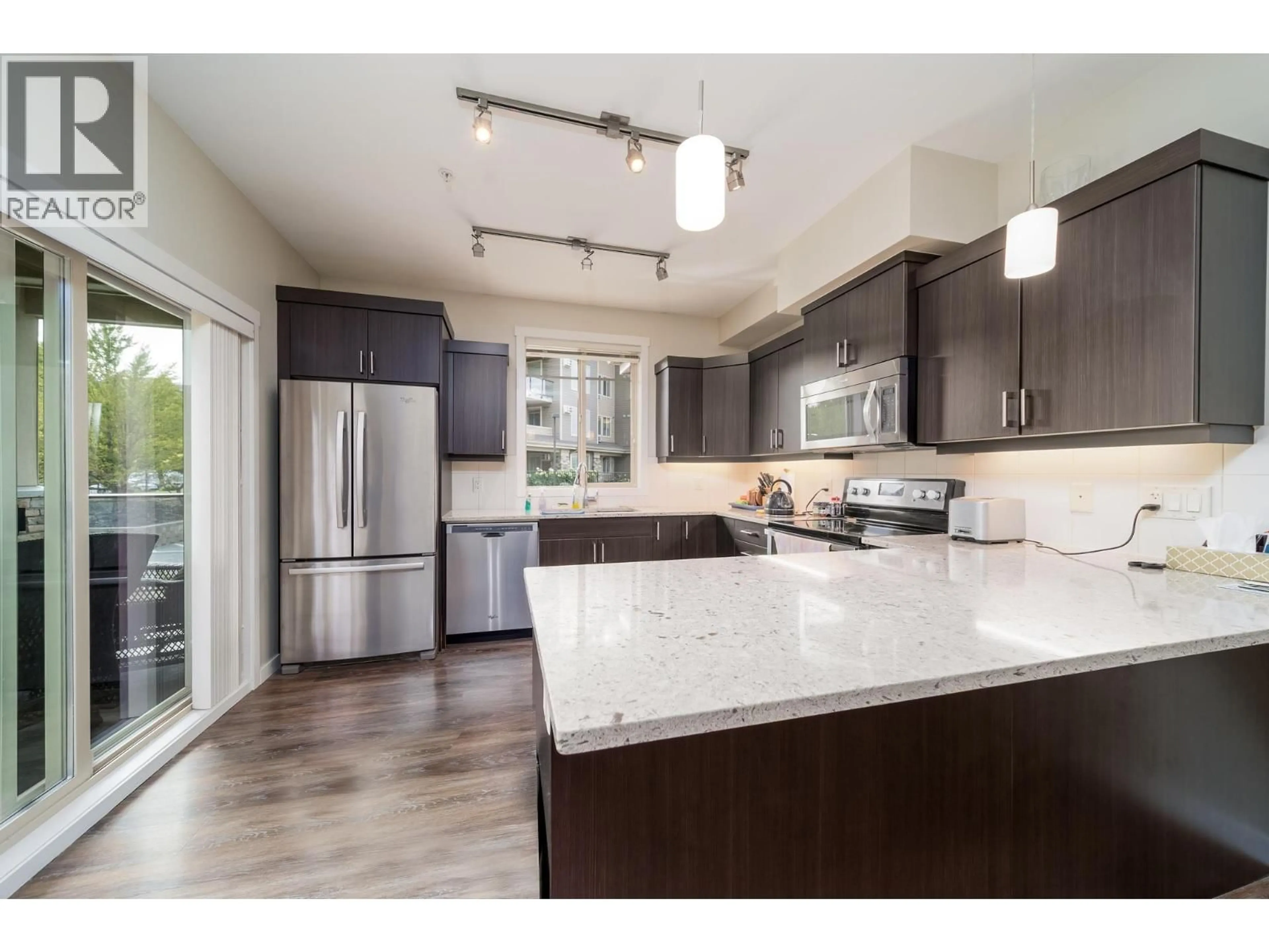 Open concept kitchen, unknown for 104 - 3733 CASORSO ROAD, Kelowna British Columbia V1W5E3