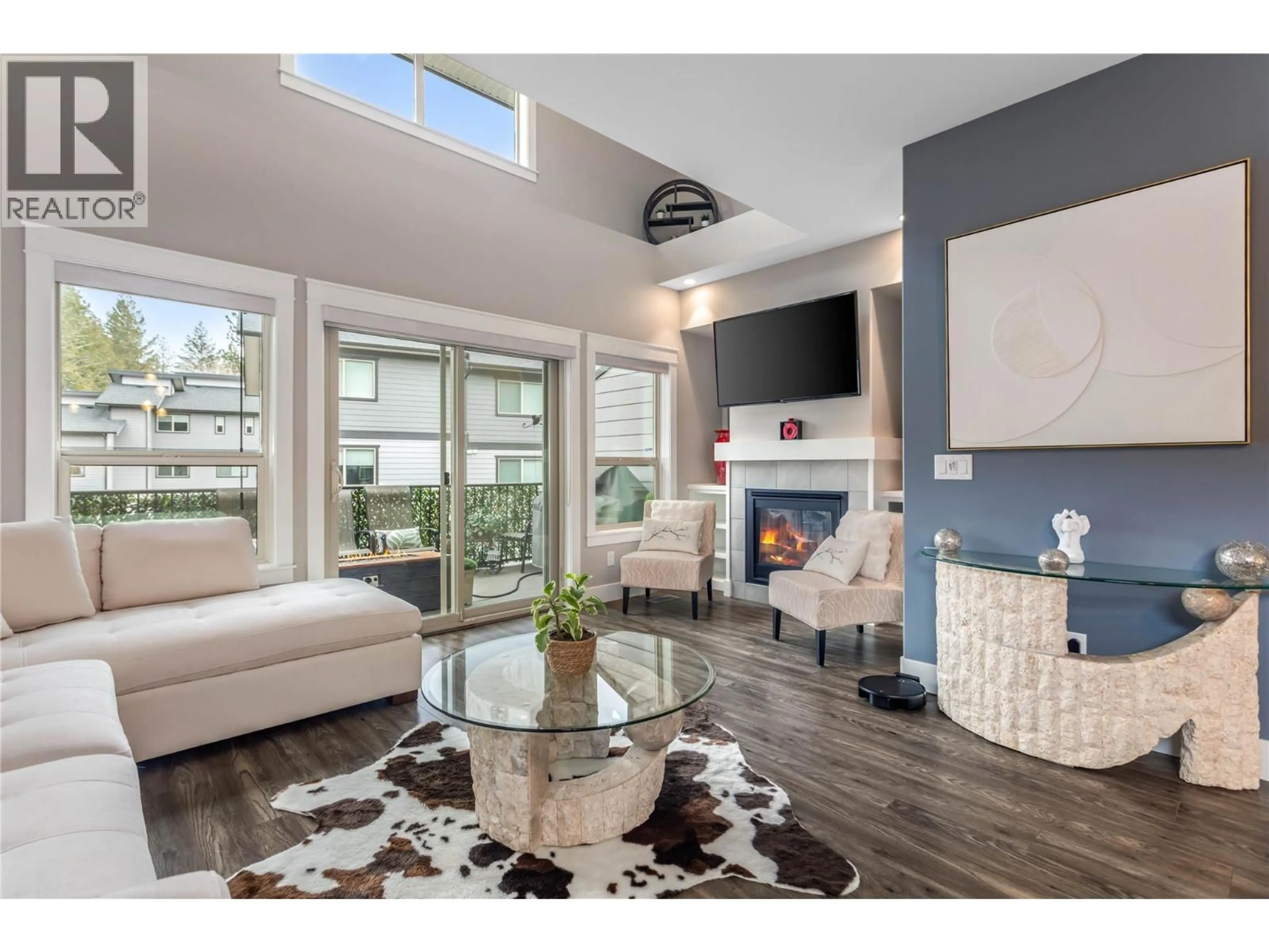 Living room with furniture, wood/laminate floor for 60 - 3359 COUGAR ROAD, West Kelowna British Columbia V4T3G1