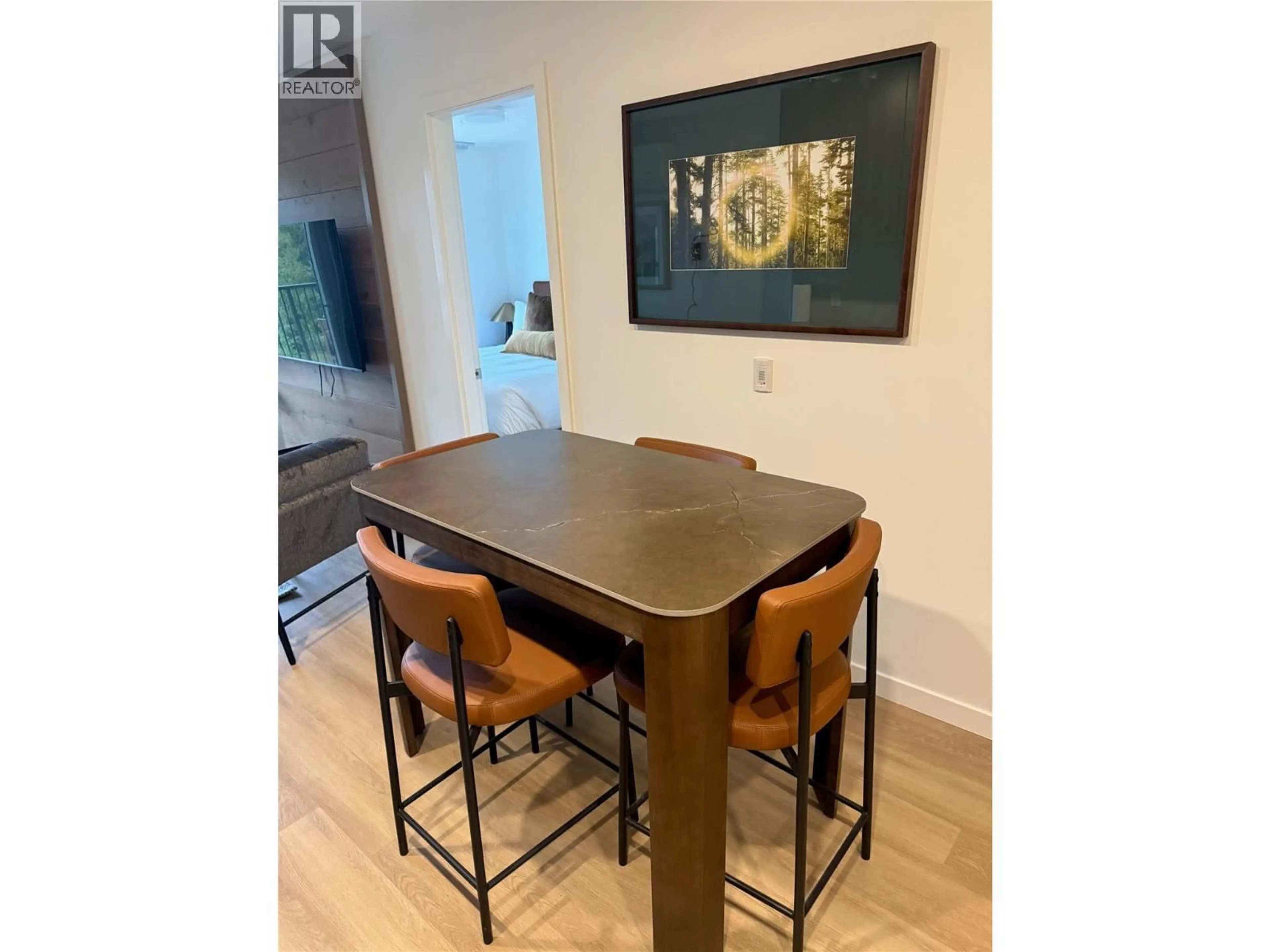 Dining room, wood/laminate floor for 203 - 4240 RED MOUNTAIN ROAD STREET, Rossland British Columbia V0G1Y0