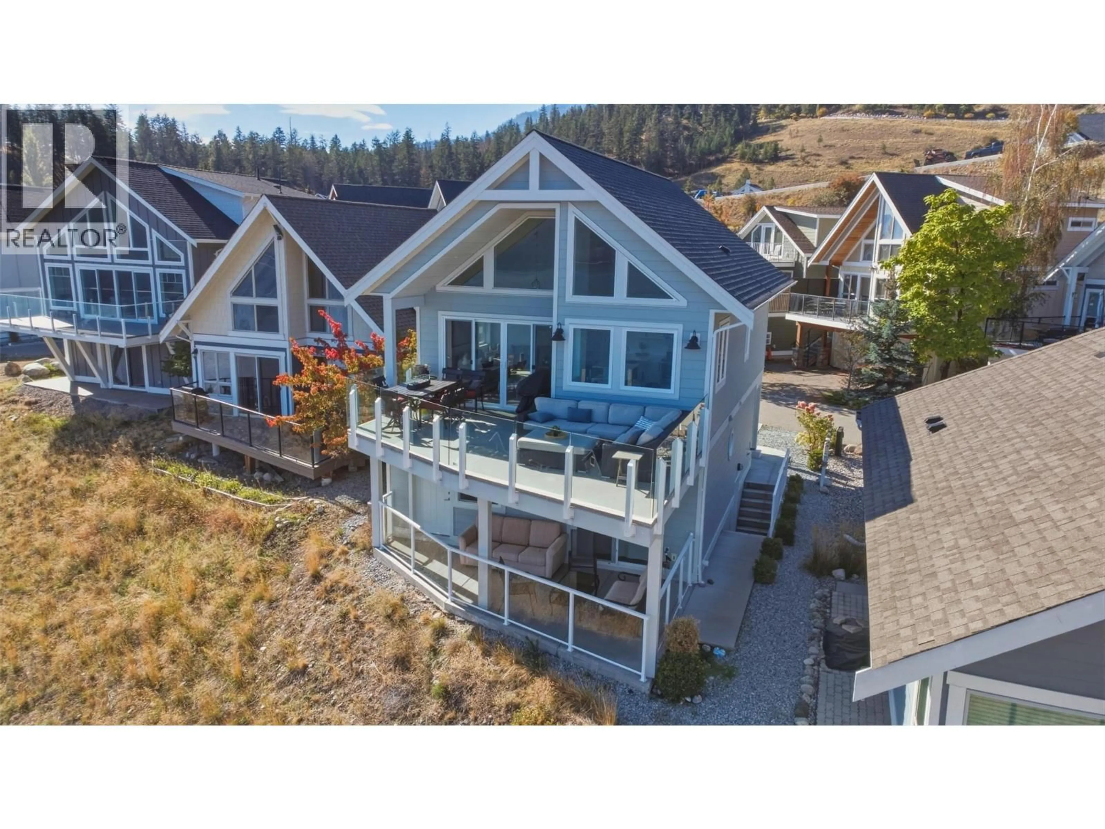 A pic from outside/outdoor area/front of a property/back of a property/a pic from drone, mountain view for 238 - 6715 LA PALMA LOOP, Kelowna British Columbia V1Z3R8