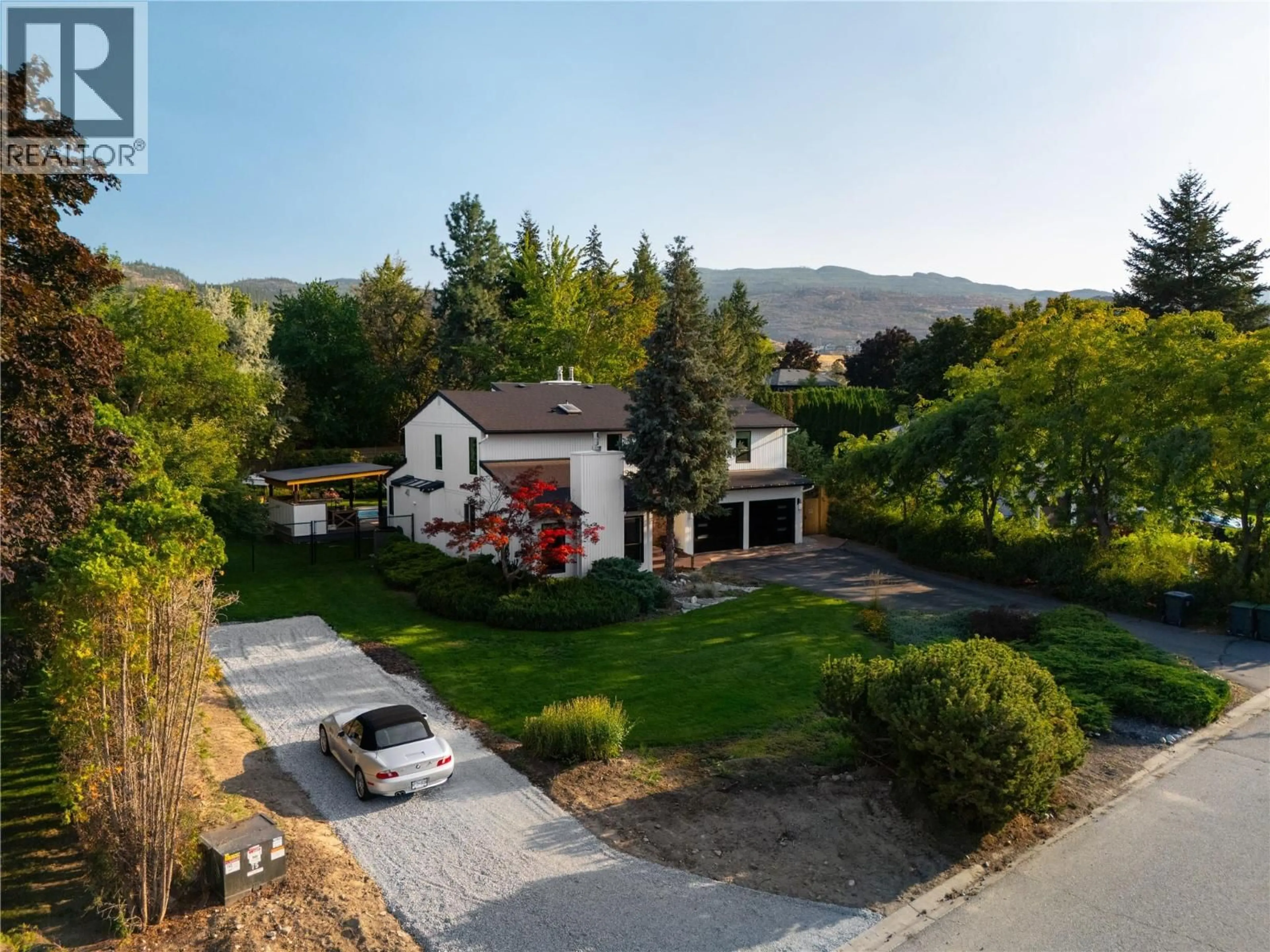 A pic from outside/outdoor area/front of a property/back of a property/a pic from drone, mountain view for 1411 APPLERIDGE ROAD, Kelowna British Columbia V1W3A6