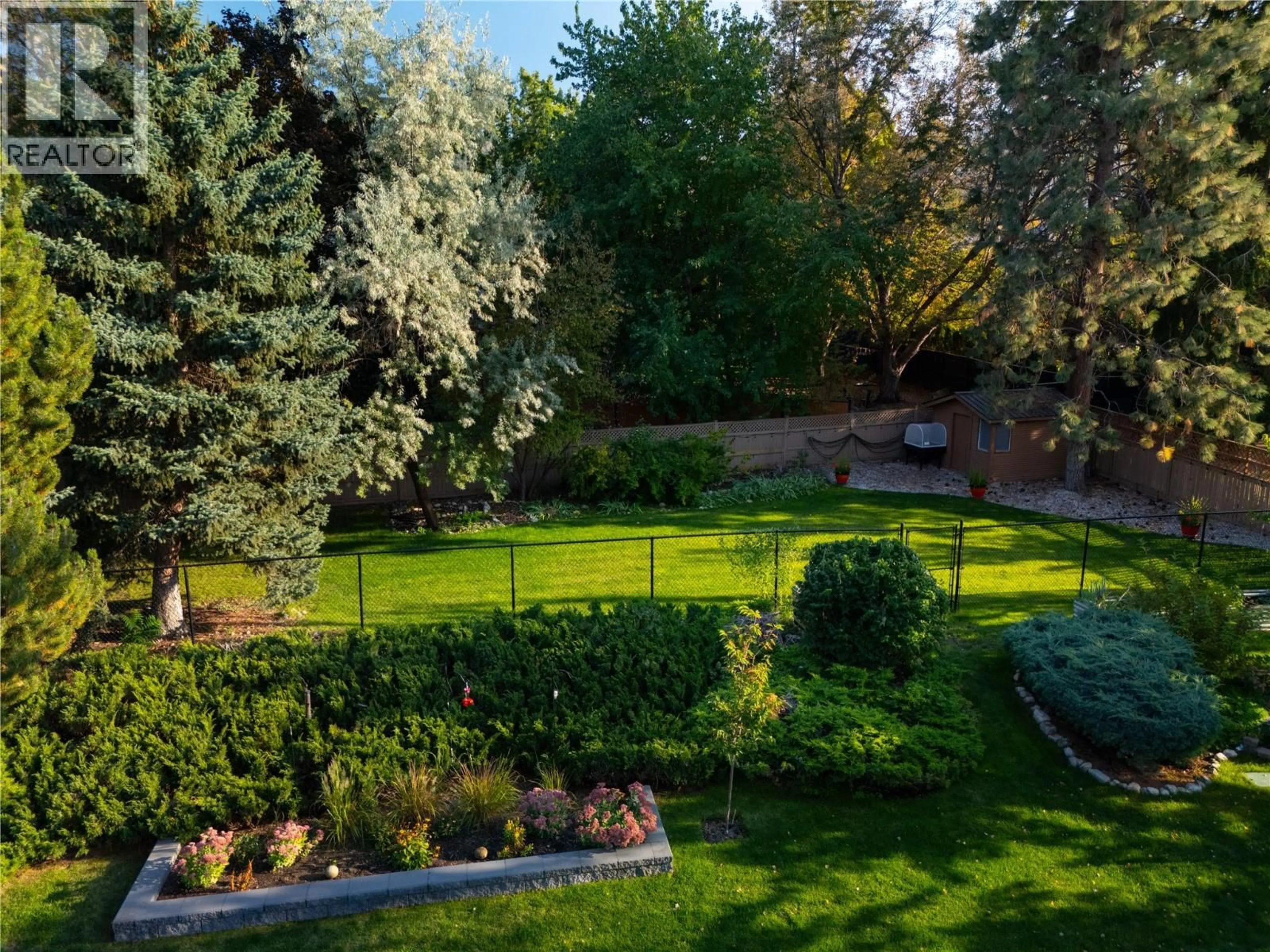 A pic from outside/outdoor area/front of a property/back of a property/a pic from drone, forest/trees view for 1411 APPLERIDGE ROAD, Kelowna British Columbia V1W3A6