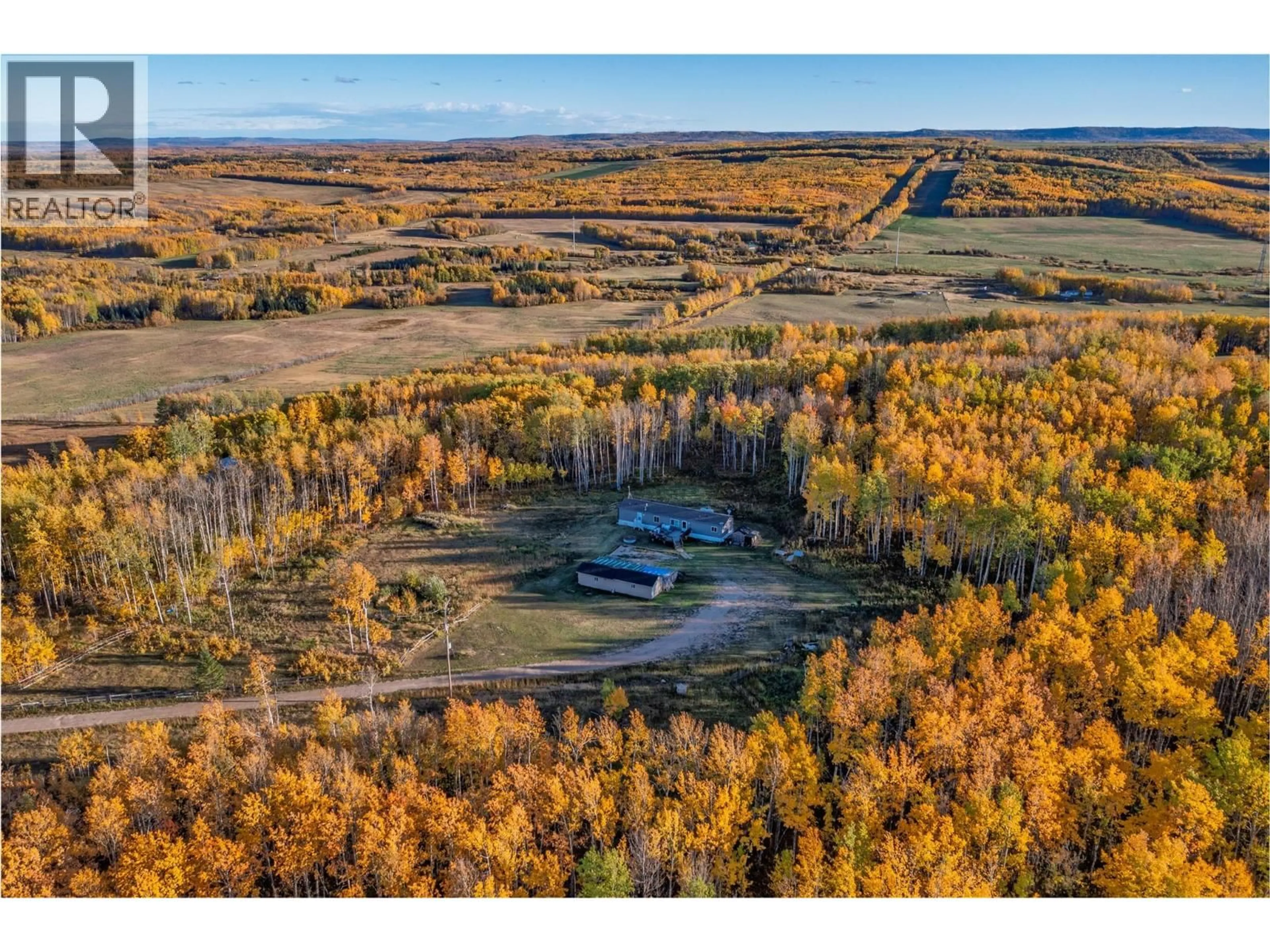 A pic from outside/outdoor area/front of a property/back of a property/a pic from drone, forest/trees view for 10111 253 ROAD, Dawson Creek British Columbia V0C2E0
