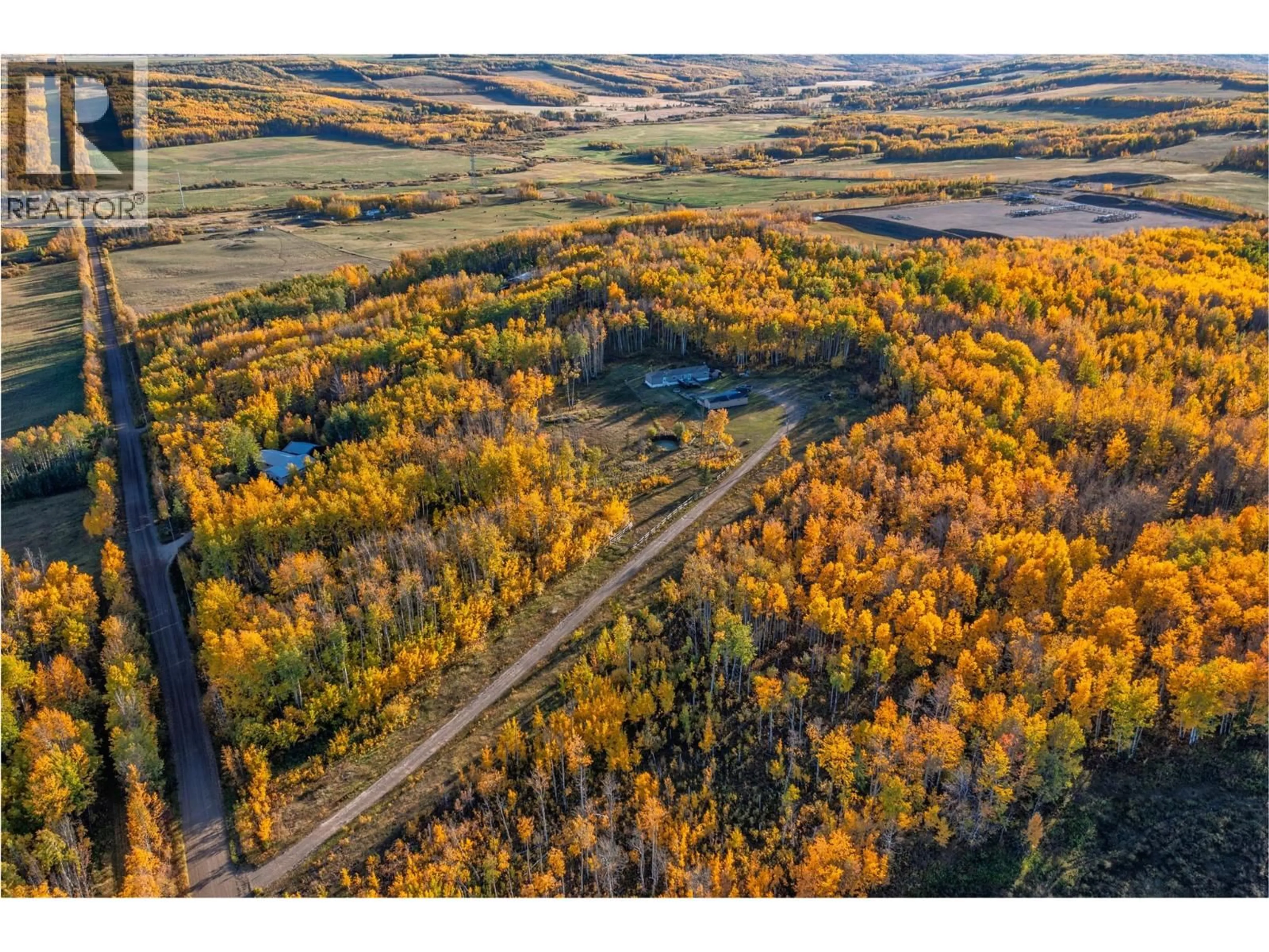 A pic from outside/outdoor area/front of a property/back of a property/a pic from drone, forest/trees view for 10111 253 ROAD, Dawson Creek British Columbia V0C2E0