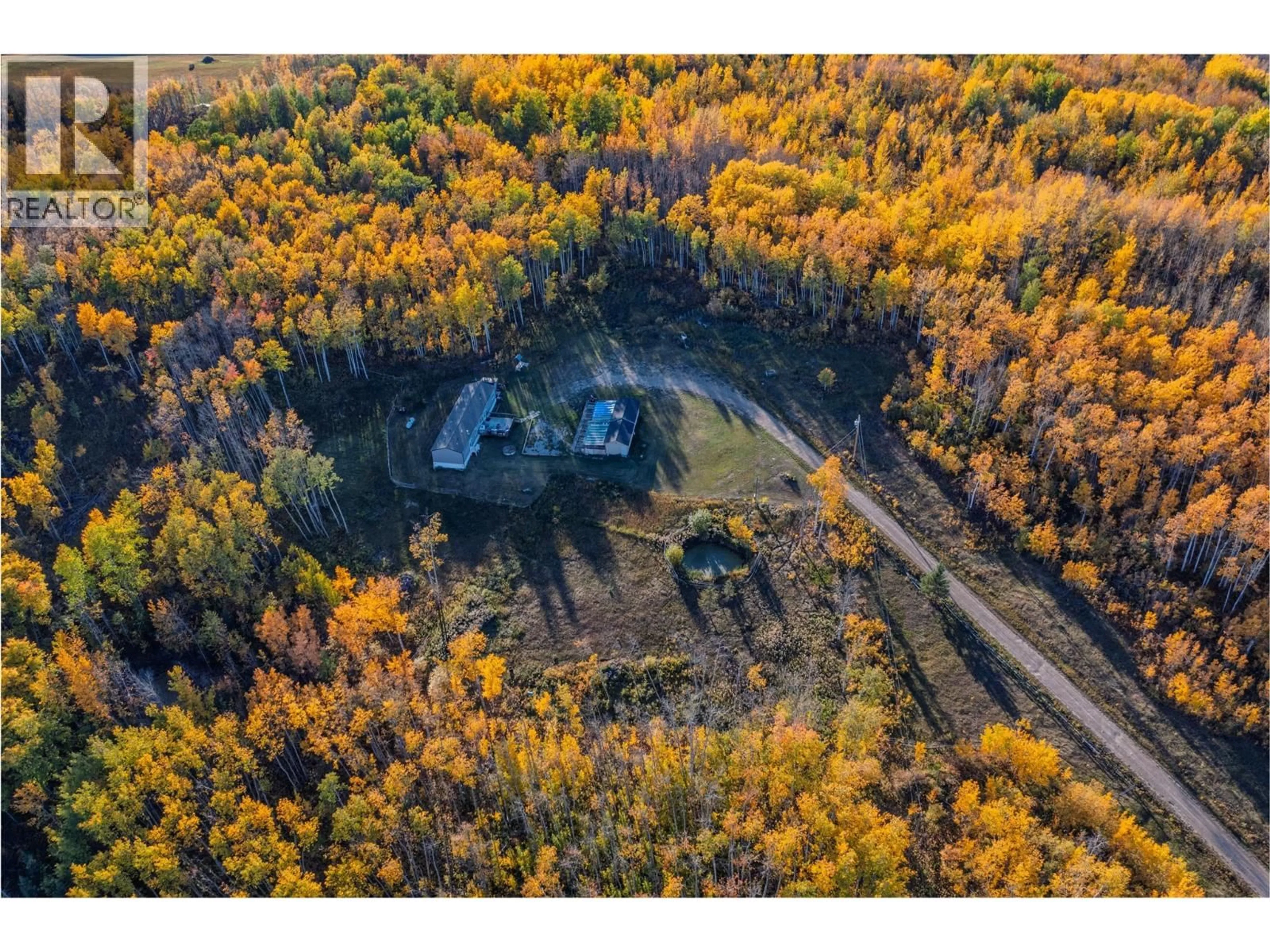 A pic from outside/outdoor area/front of a property/back of a property/a pic from drone, forest/trees view for 10111 253 ROAD, Dawson Creek British Columbia V0C2E0