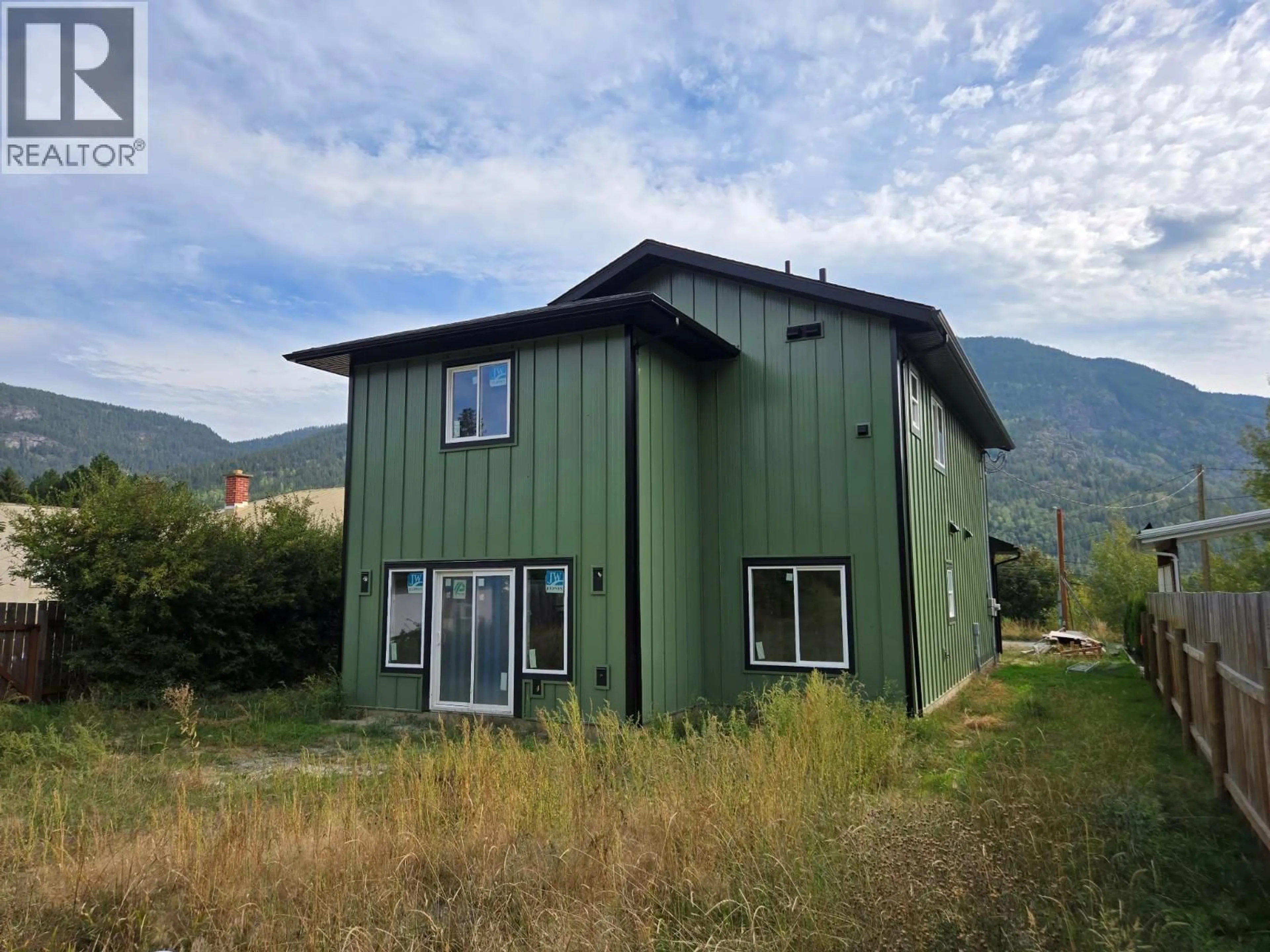 Home with vinyl exterior material, mountain view for 209 12TH AVENUE FRONTAGE ROAD, Genelle British Columbia V0G1G0