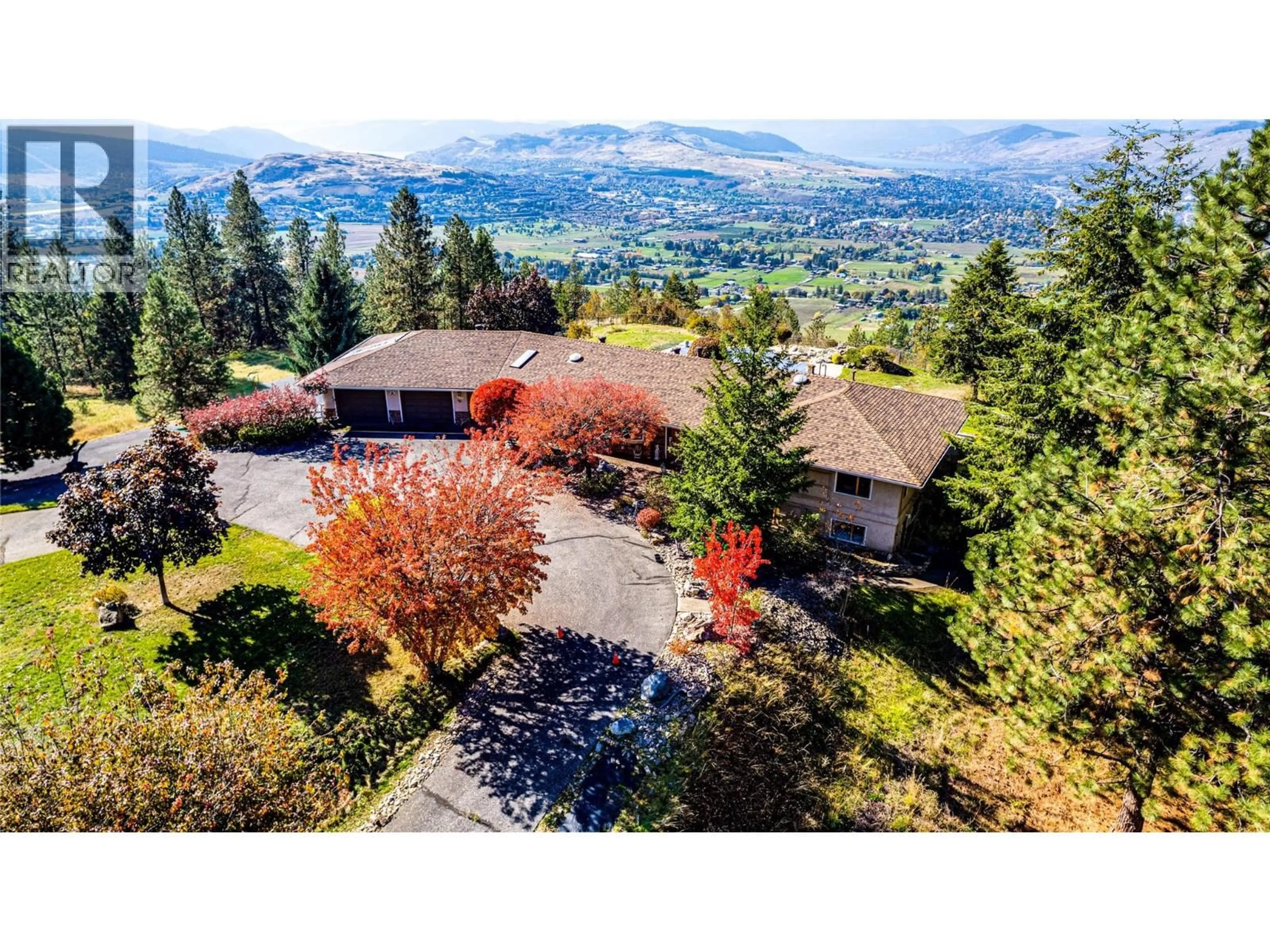 A pic from outside/outdoor area/front of a property/back of a property/a pic from drone, mountain view for 3200 GREENWOOD ROAD, Vernon British Columbia V1B4G5