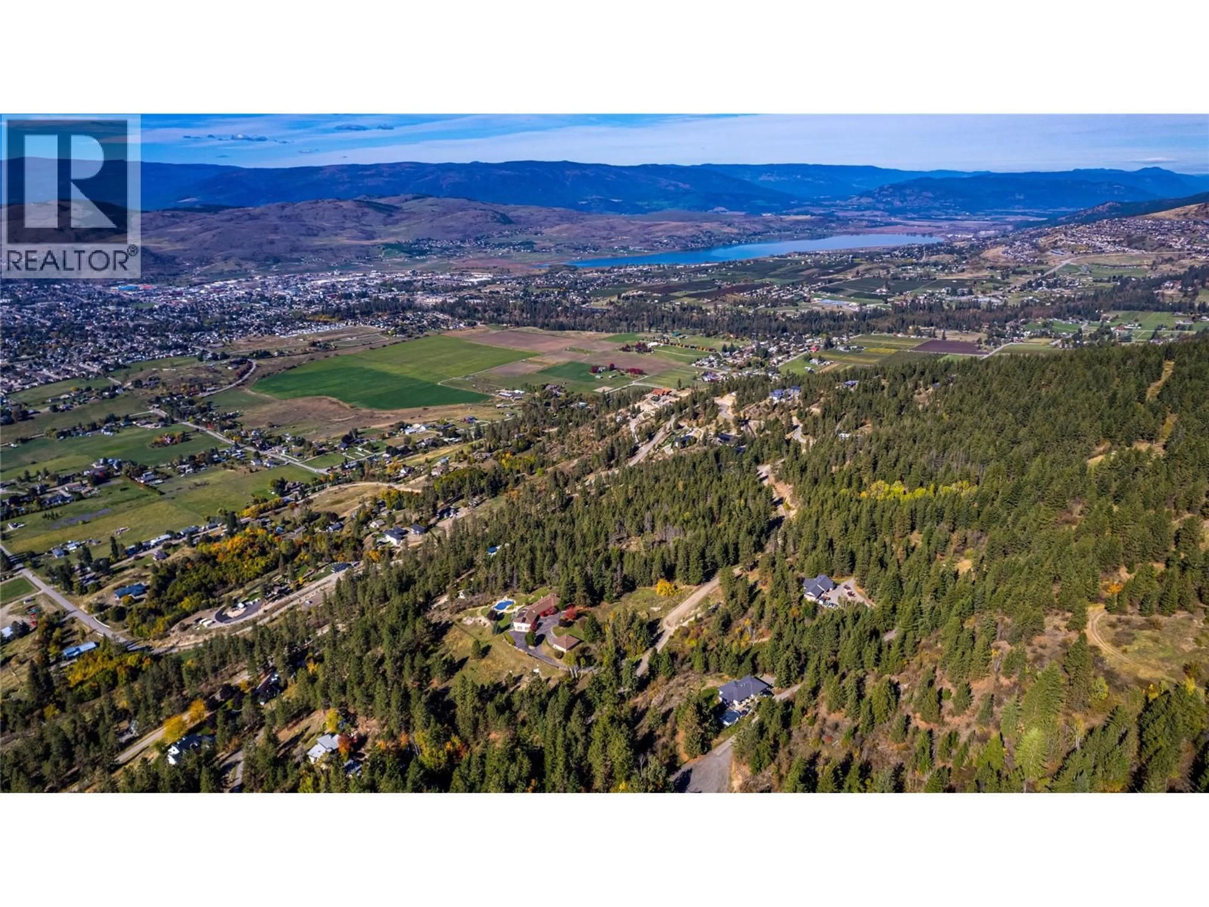A pic from outside/outdoor area/front of a property/back of a property/a pic from drone, mountain view for 3200 GREENWOOD ROAD, Vernon British Columbia V1B4G5