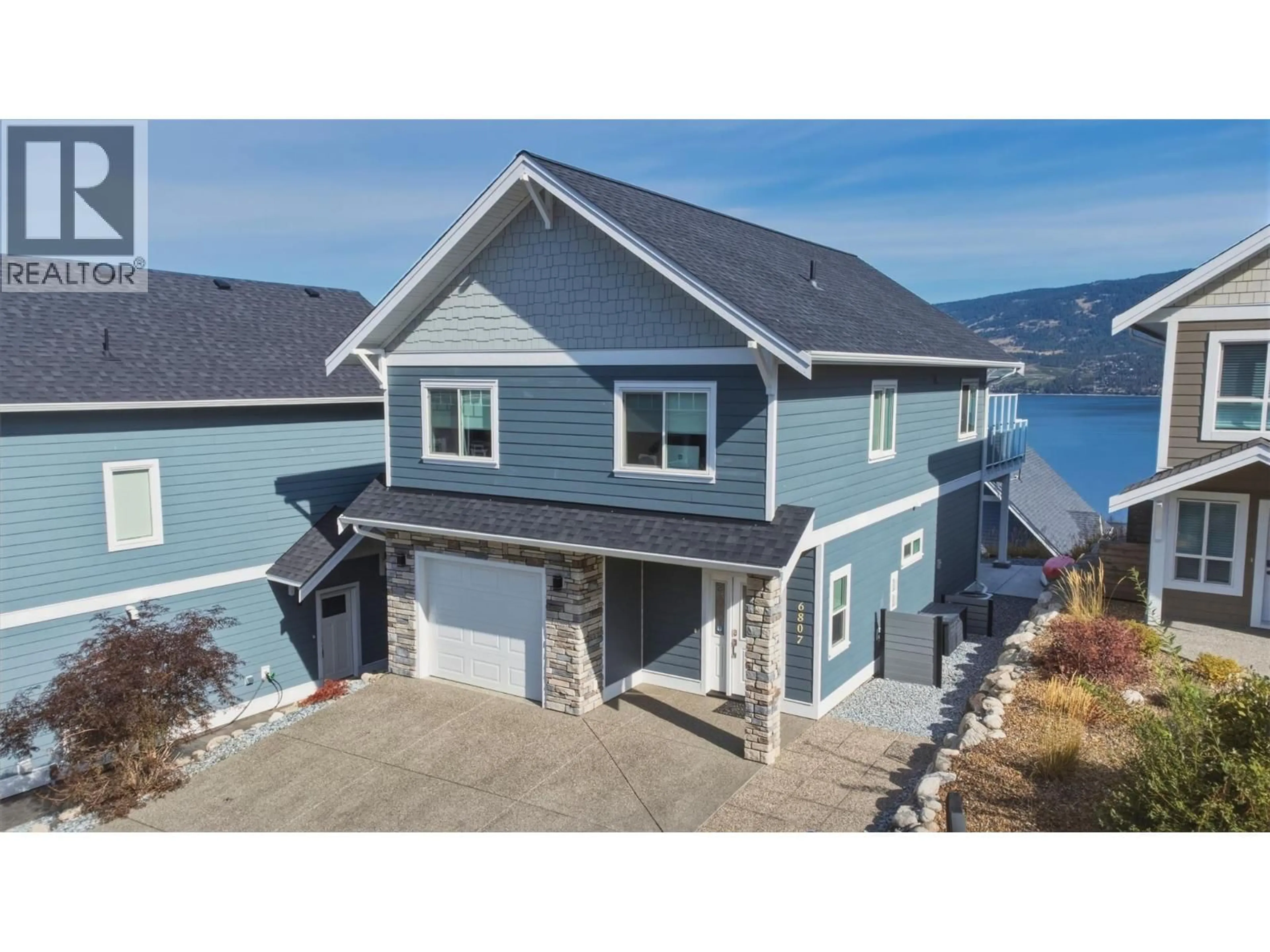 A pic from outside/outdoor area/front of a property/back of a property/a pic from drone, water/lake/river/ocean view for 151 - 6807 SANTIAGO LOOP, Kelowna British Columbia V1Z3R8