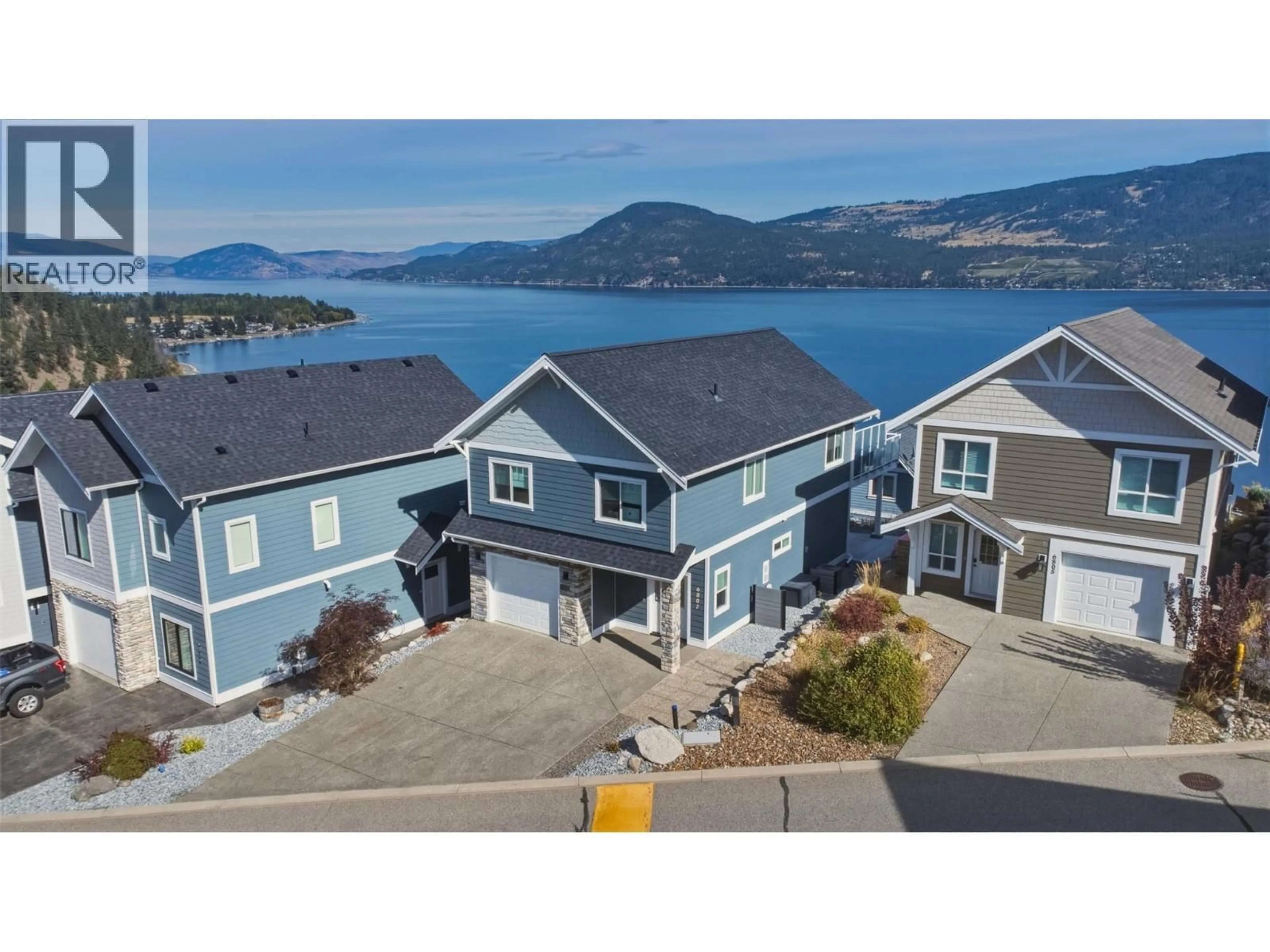 A pic from outside/outdoor area/front of a property/back of a property/a pic from drone, water/lake/river/ocean view for 151 - 6807 SANTIAGO LOOP, Kelowna British Columbia V1Z3R8