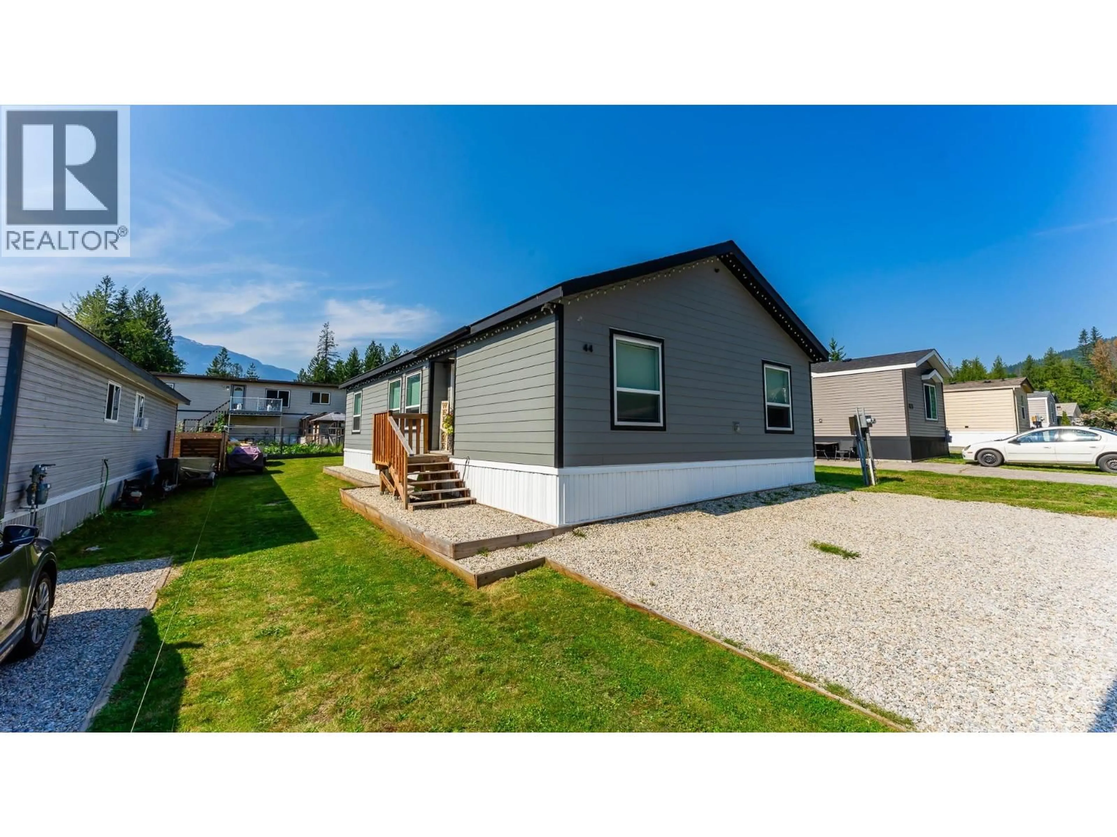 Home with vinyl exterior material, street for 44 JOHNSON WAY, Revelstoke British Columbia V0E2S0