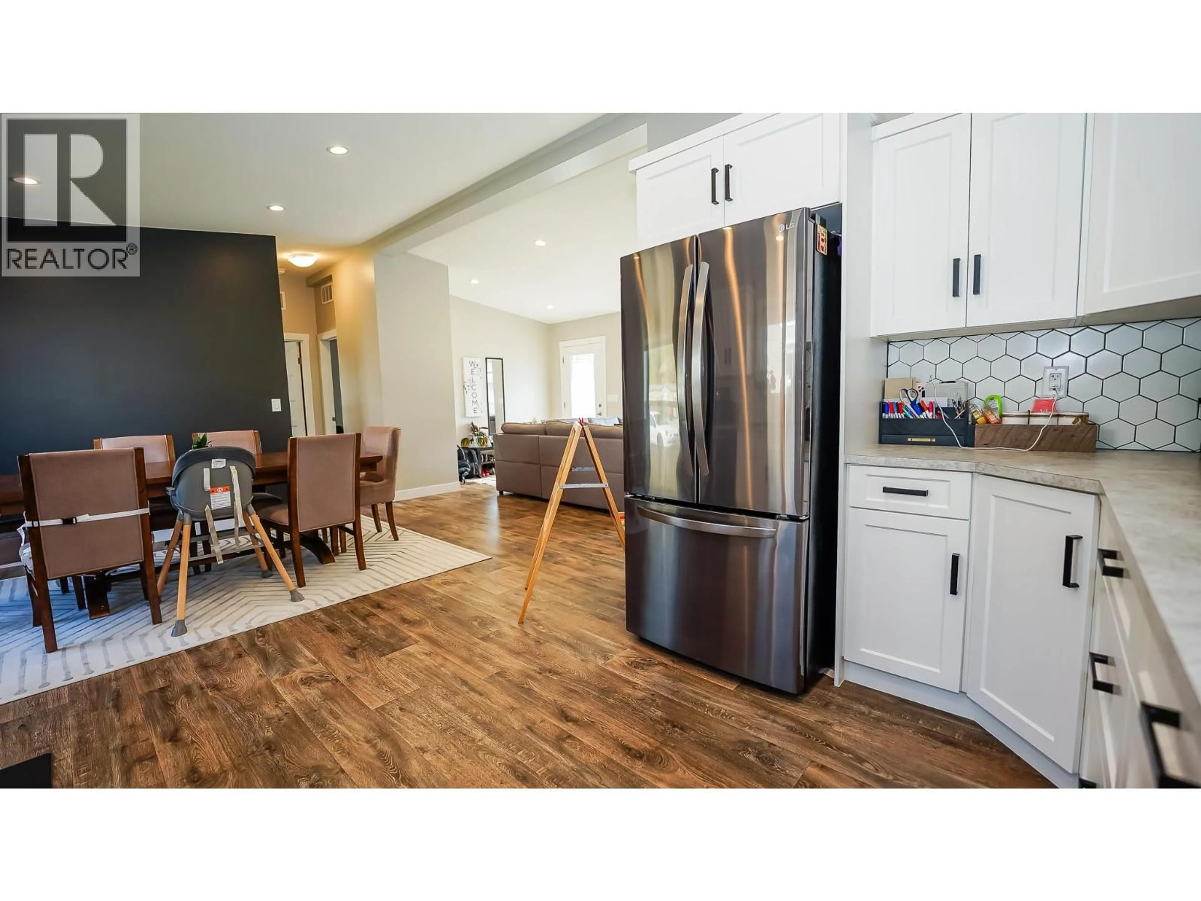 Open concept kitchen, wood/laminate floor for 44 JOHNSON WAY, Revelstoke British Columbia V0E2S0