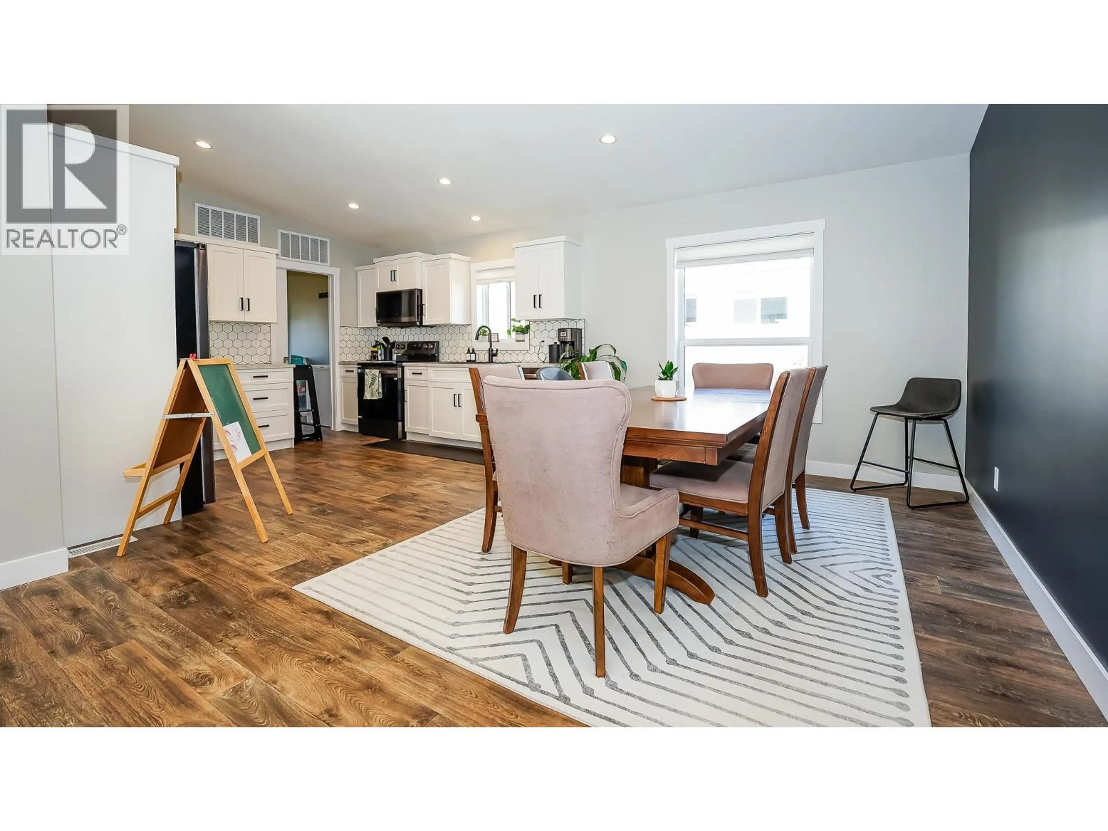 Open concept kitchen, wood/laminate floor for 44 JOHNSON WAY, Revelstoke British Columbia V0E2S0