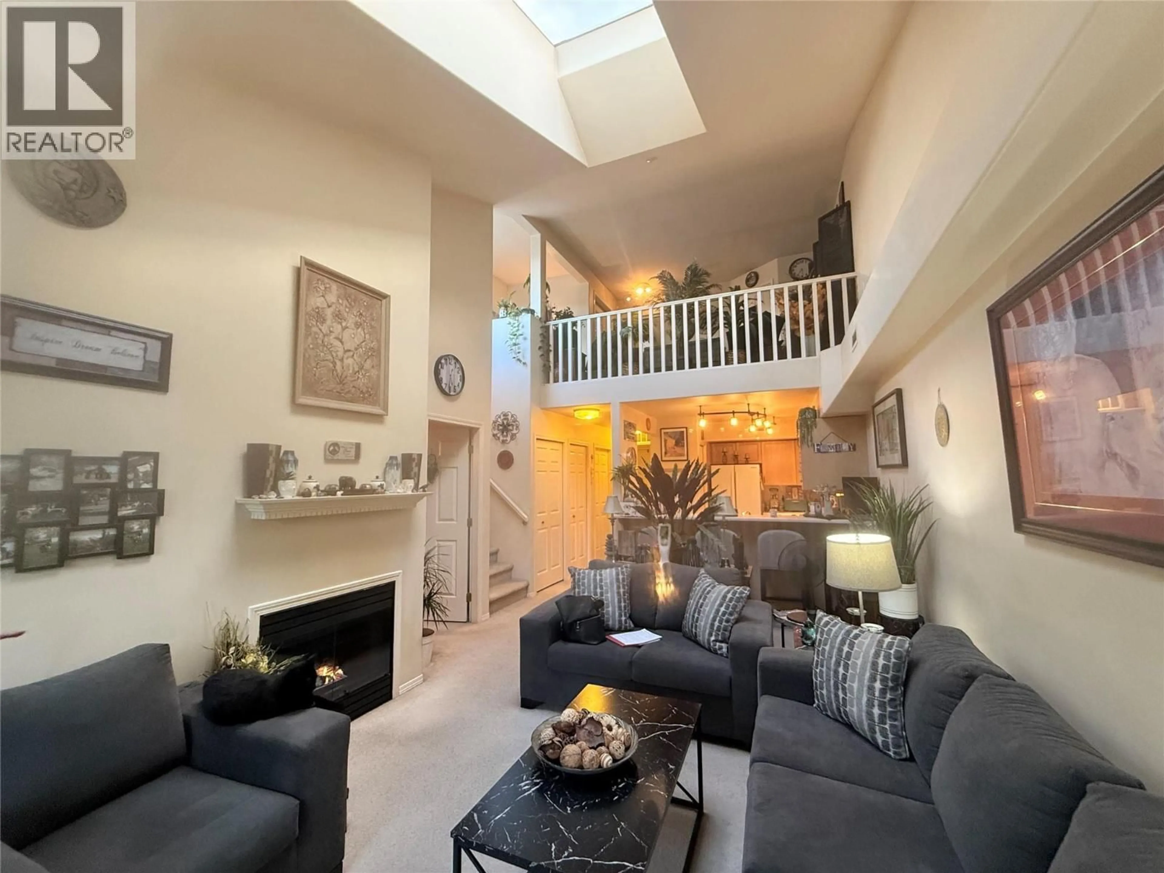 Living room with furniture, unknown for 407 - 3115 DE MONTREUIL COURT, Kelowna British Columbia V1W3w1