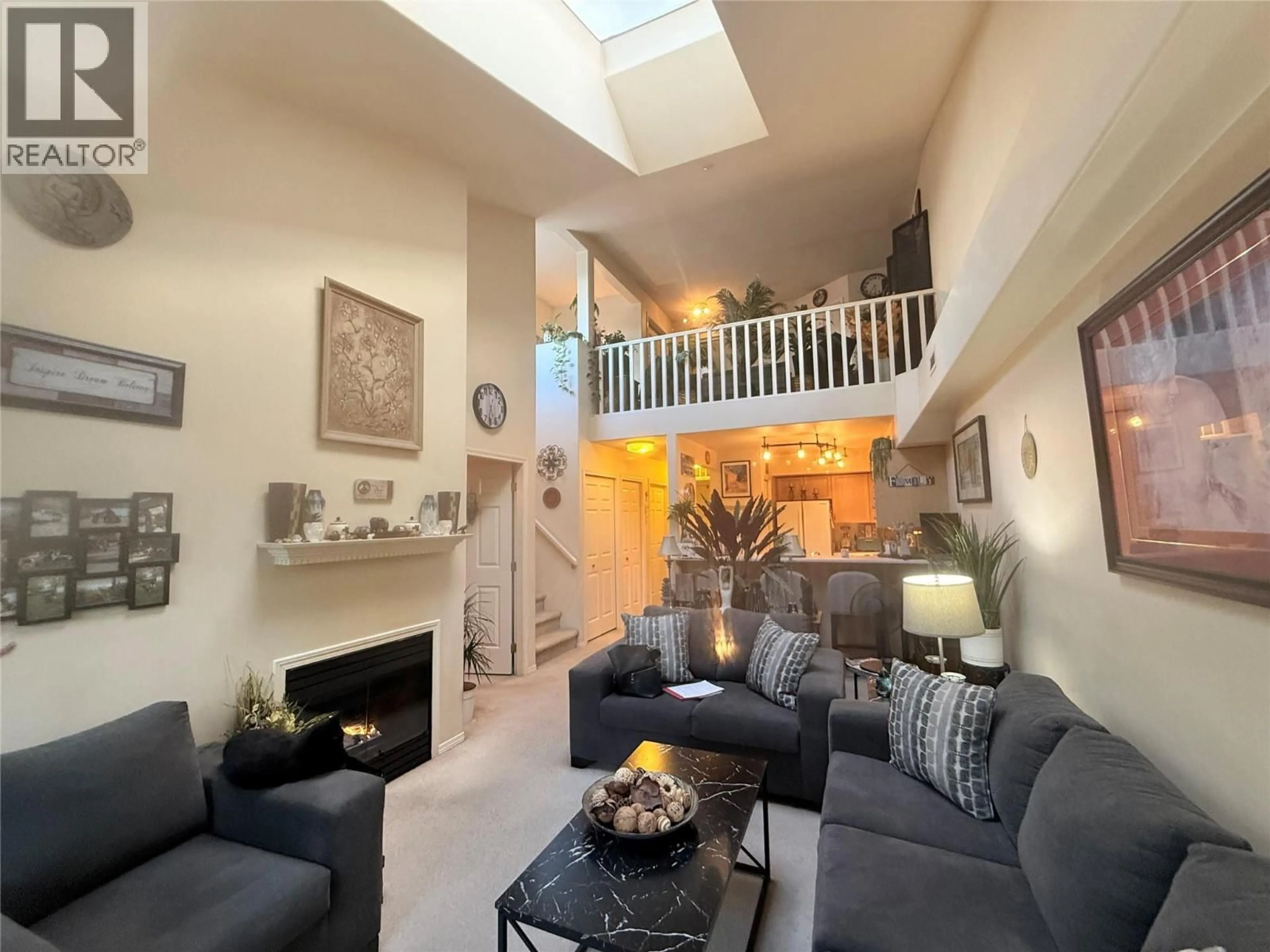 Living room with furniture, unknown for 407 - 3115 DE MONTREUIL COURT, Kelowna British Columbia V1W3w1