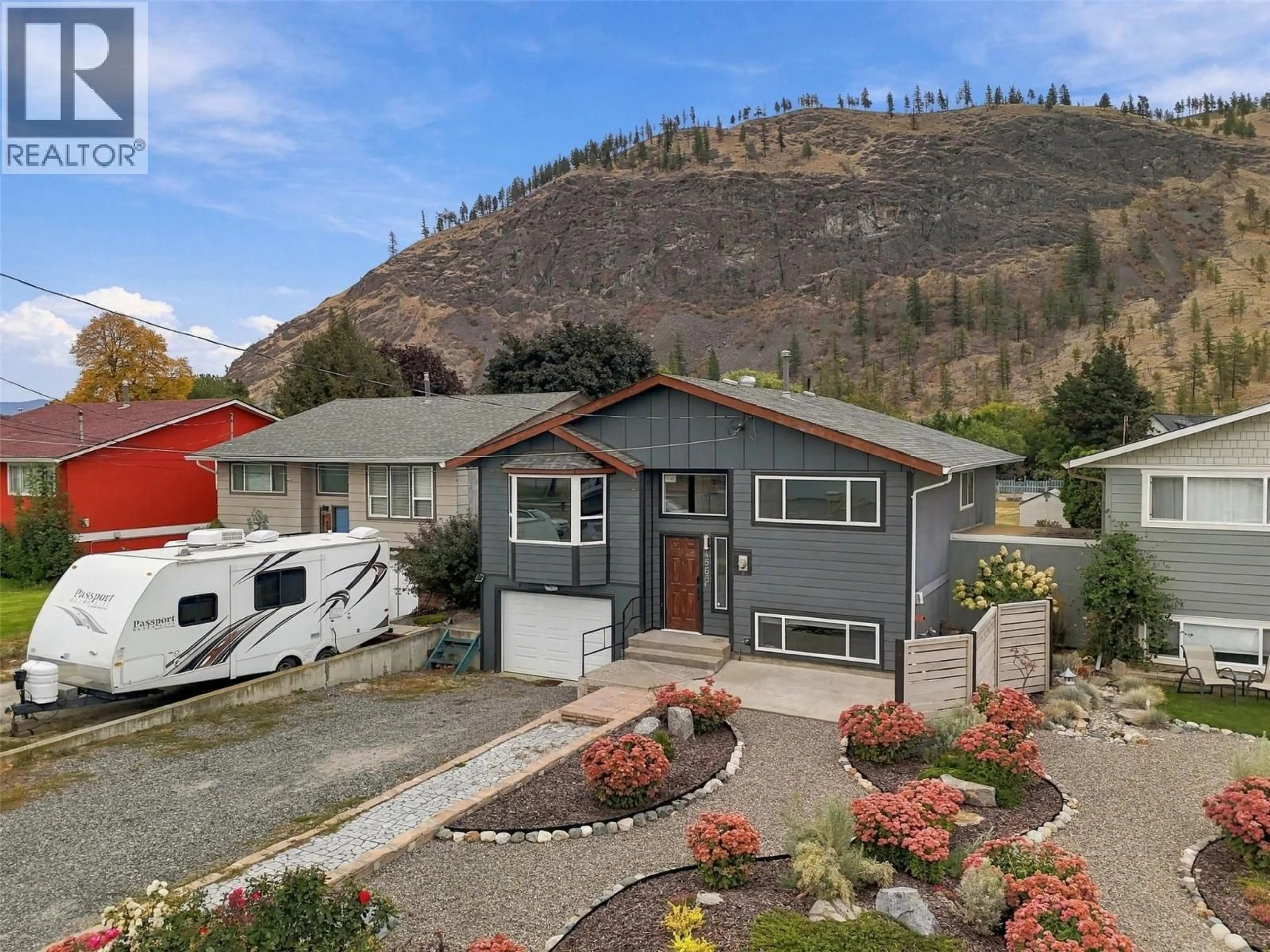 A pic from outside/outdoor area/front of a property/back of a property/a pic from drone, mountain view for 4568 CAMMERAY DRIVE, Kamloops British Columbia V2H1L4