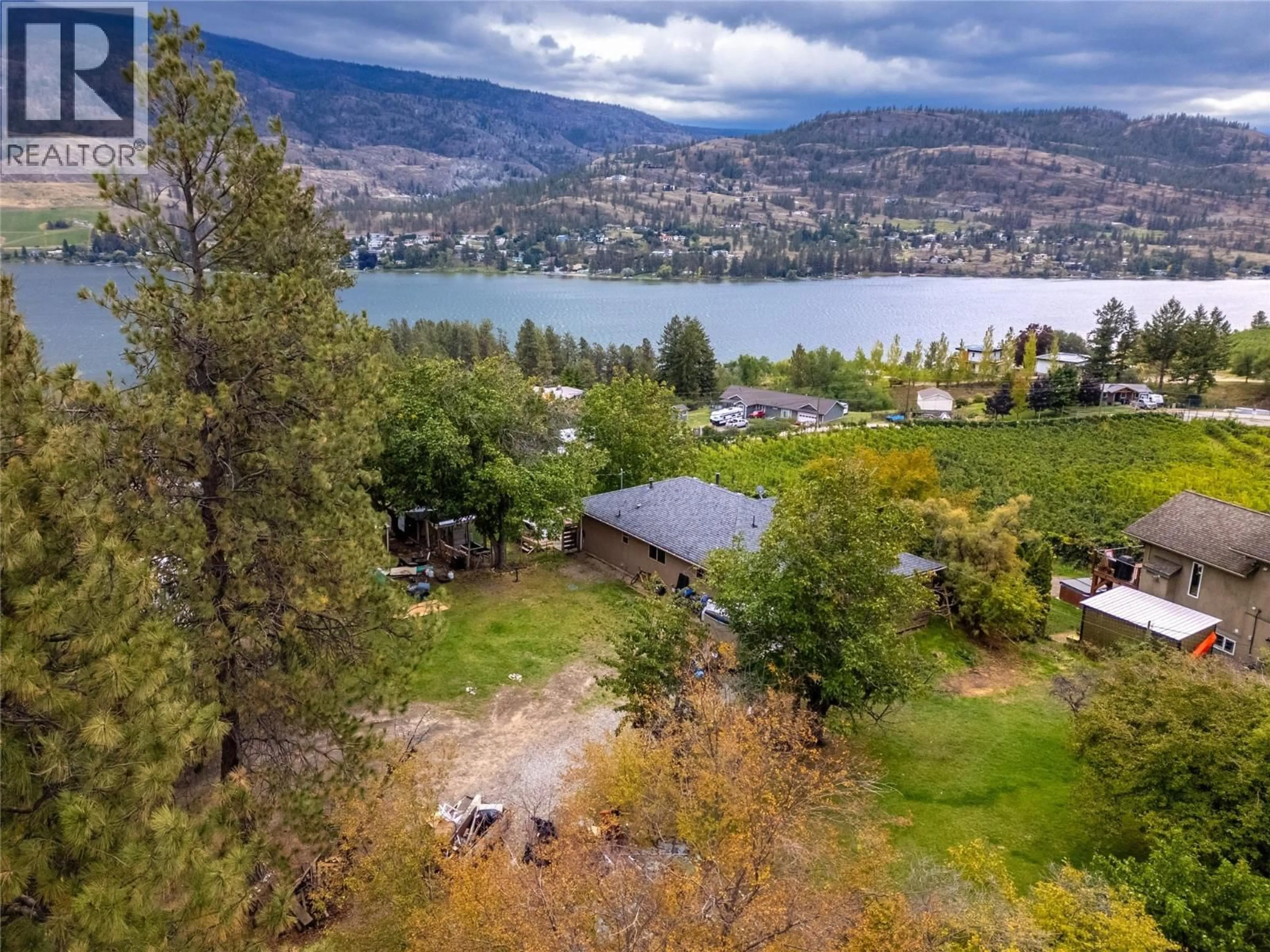A pic from outside/outdoor area/front of a property/back of a property/a pic from drone, water/lake/river/ocean view for 213 TAMARAC AVENUE, Kaleden British Columbia V0H1K0