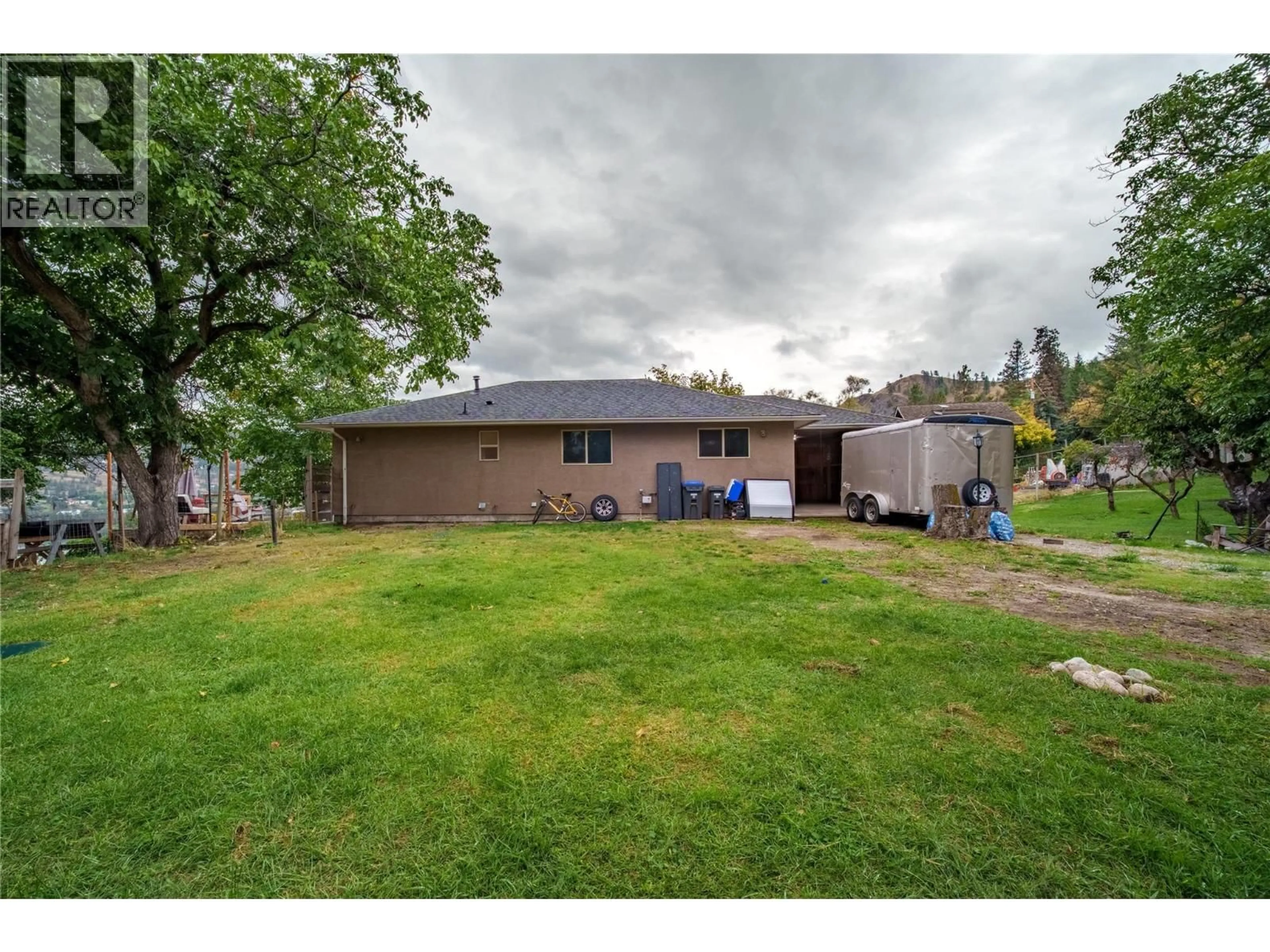 A pic from outside/outdoor area/front of a property/back of a property/a pic from drone, unknown for 213 TAMARAC AVENUE, Kaleden British Columbia V0H1K0