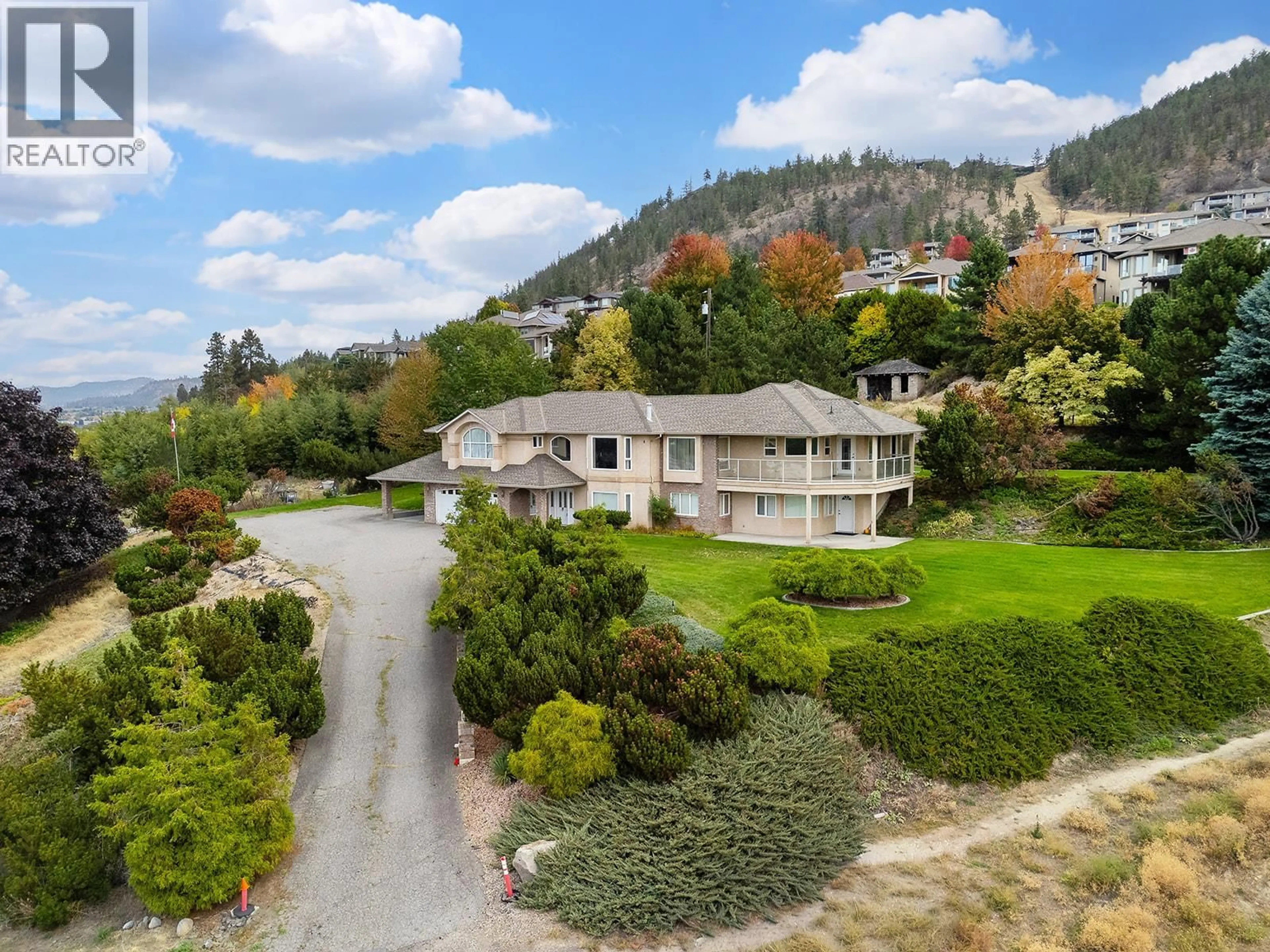 A pic from outside/outdoor area/front of a property/back of a property/a pic from drone, mountain view for 695 VALLEY ROAD, Kelowna British Columbia V1V2E6