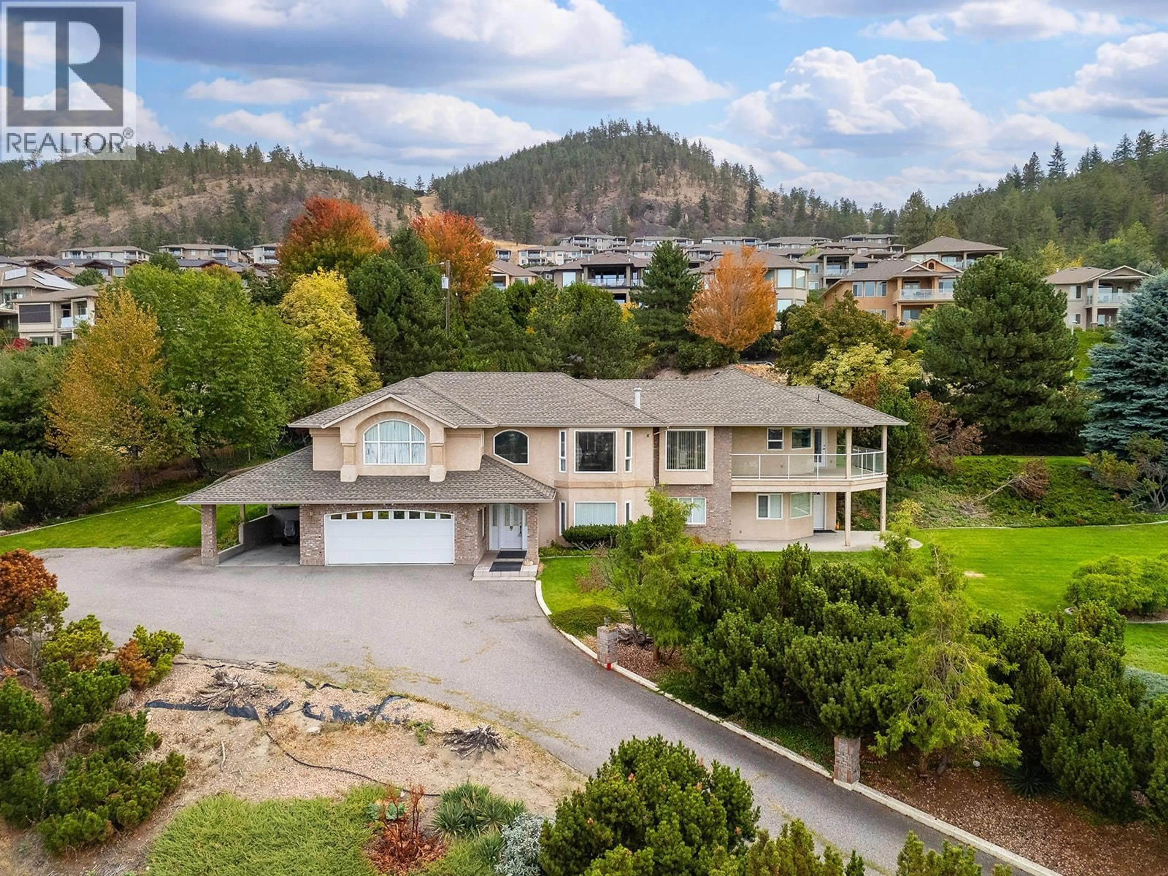 A pic from outside/outdoor area/front of a property/back of a property/a pic from drone, mountain view for 695 VALLEY ROAD, Kelowna British Columbia V1V2E6