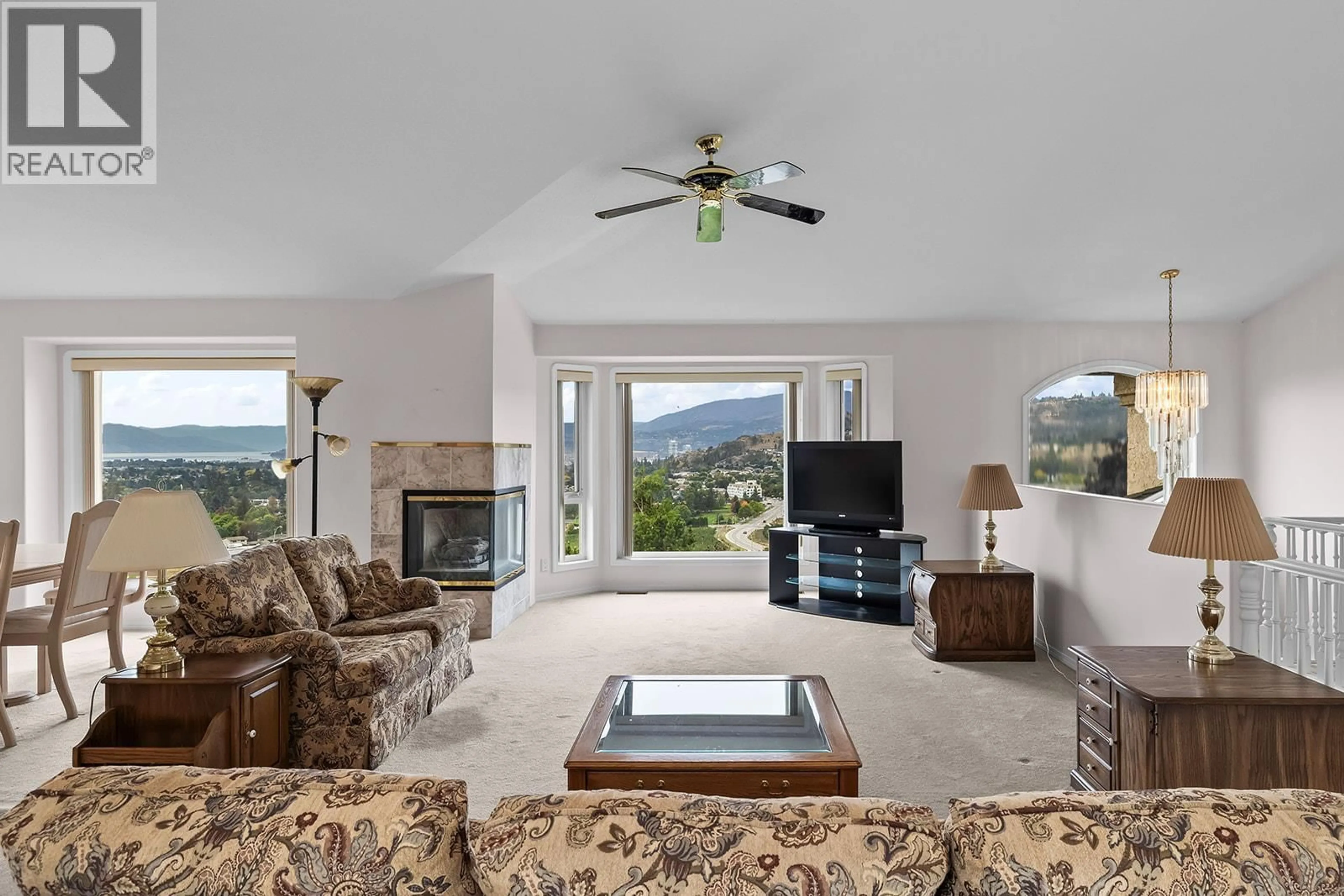 Living room with furniture, ceramic/tile floor for 695 VALLEY ROAD, Kelowna British Columbia V1V2E6