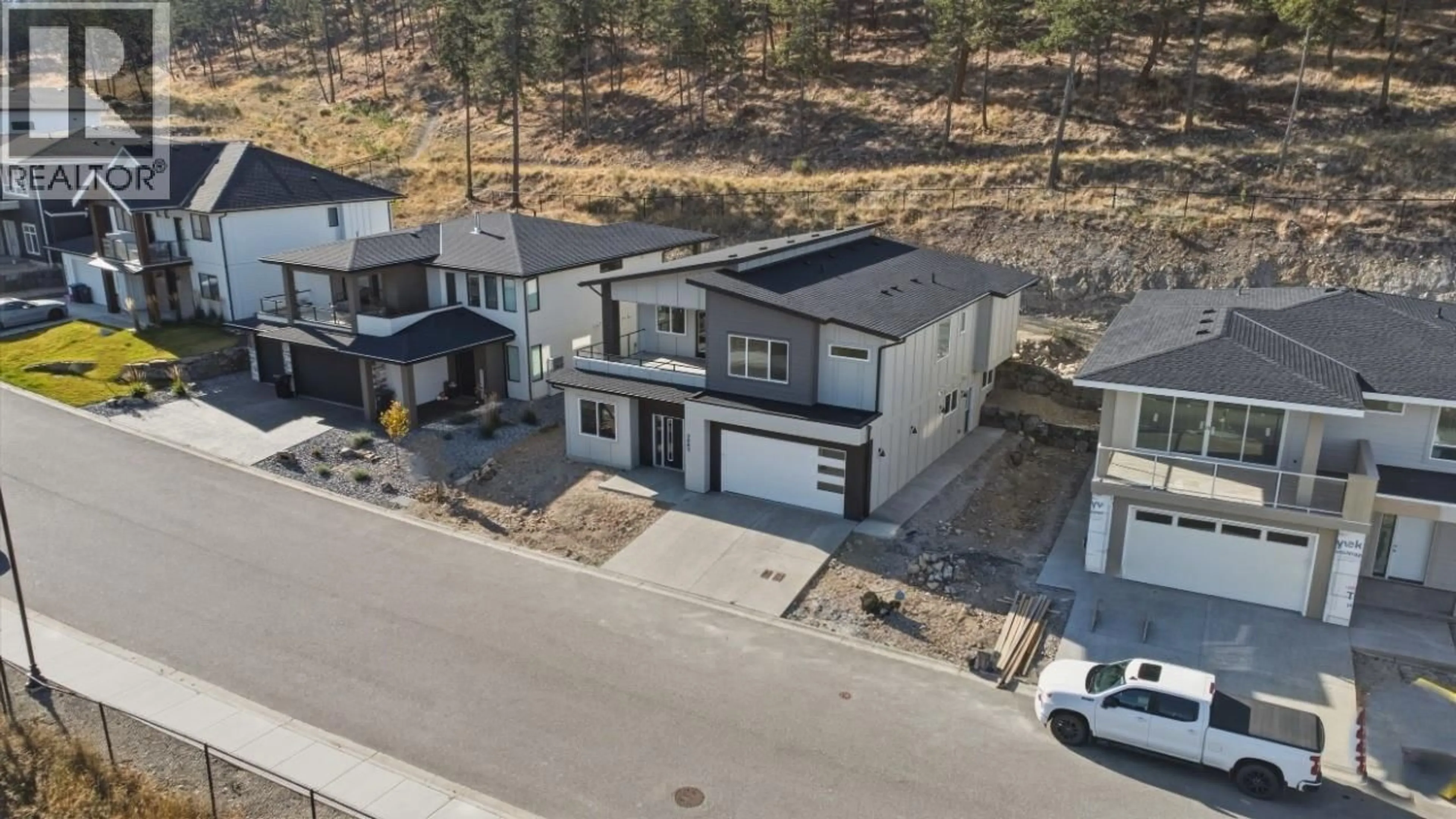 A pic from outside/outdoor area/front of a property/back of a property/a pic from drone, street for 2083 CORTINA DRIVE, Kelowna British Columbia V1P1V1