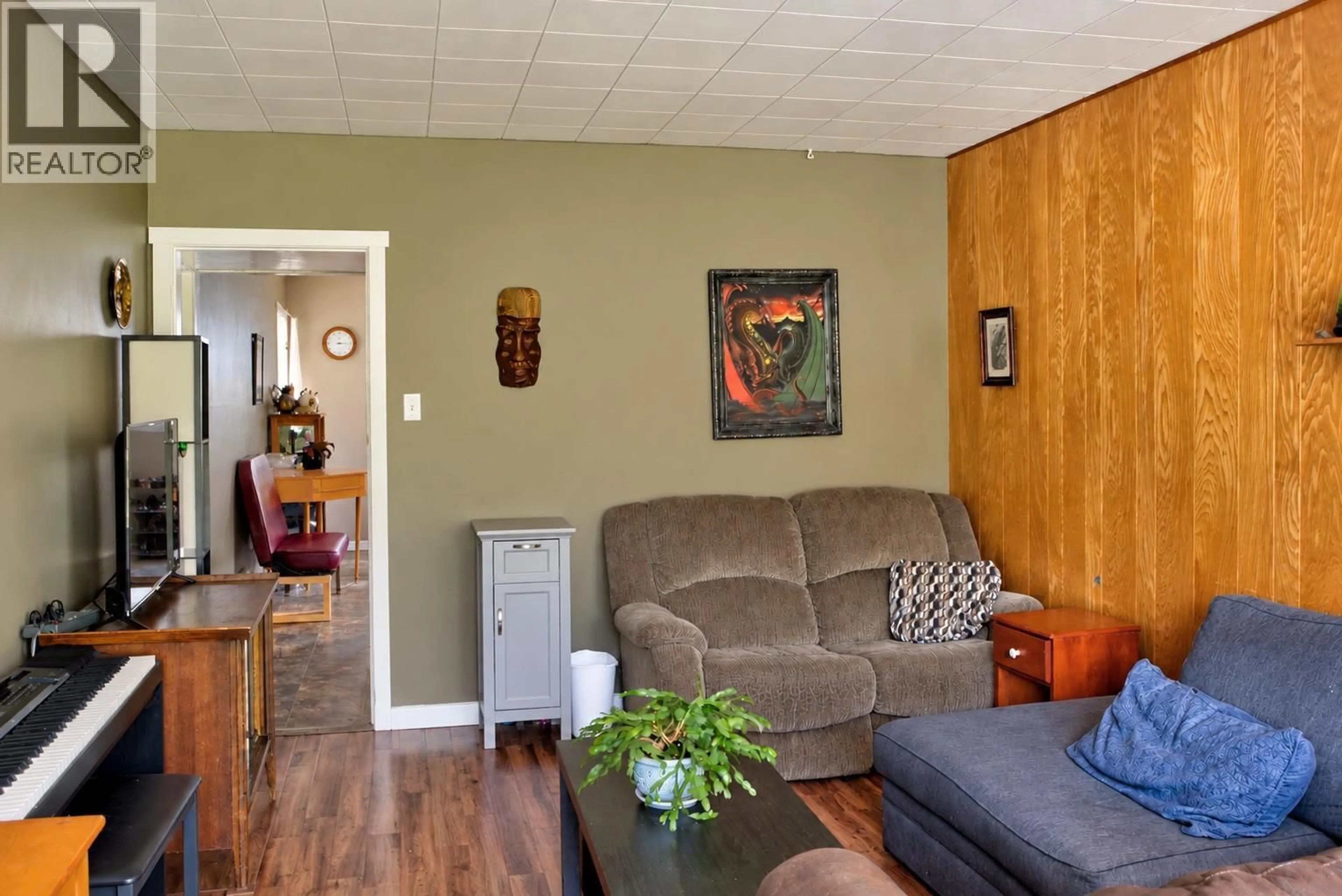 Living room with furniture, wood/laminate floor for 195 LEROSE STREET, Trail British Columbia V1R3L7