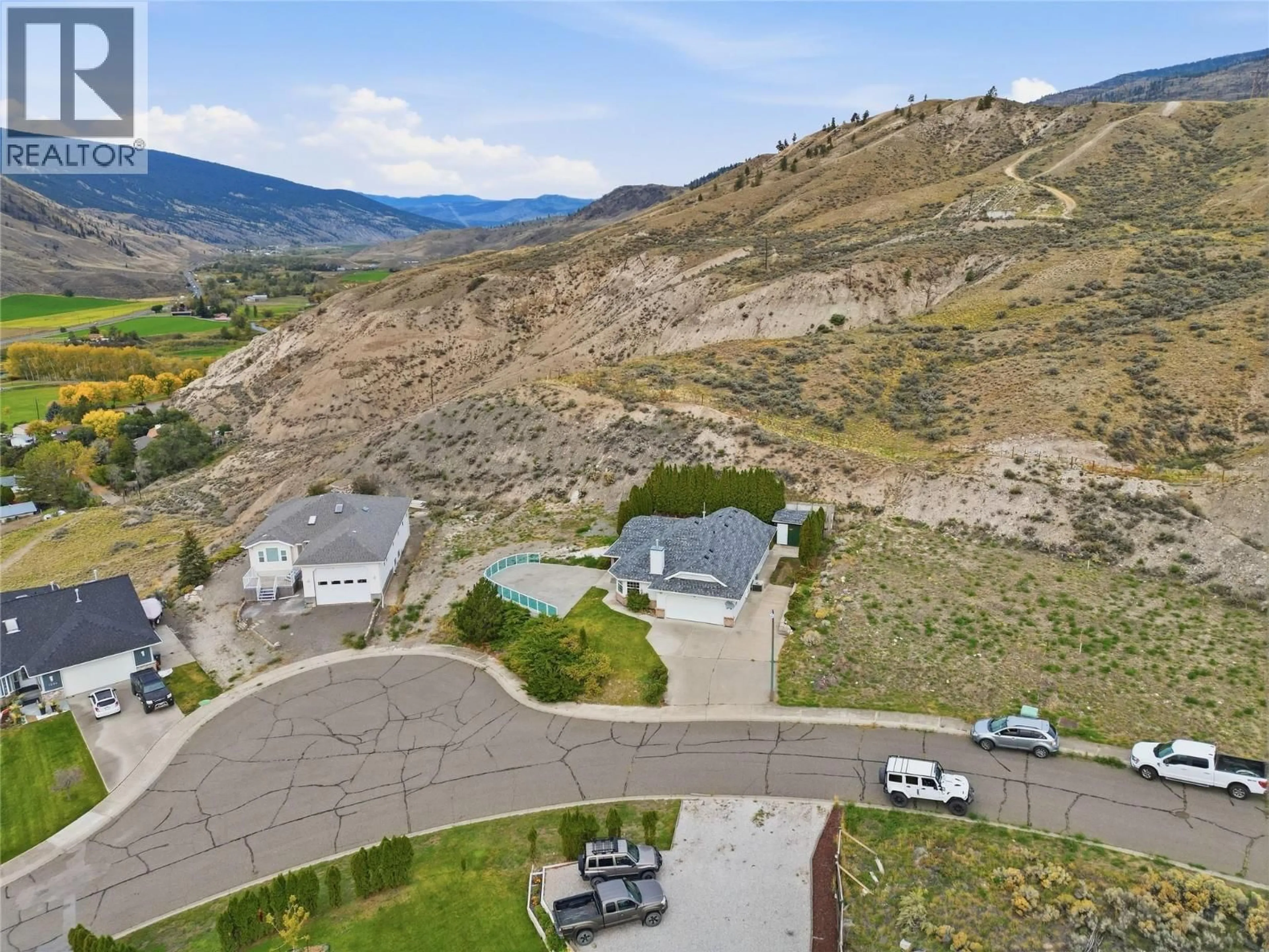 A pic from outside/outdoor area/front of a property/back of a property/a pic from drone, mountain view for 1398/1400 SEMLIN DRIVE, Cache Creek British Columbia V0K1H0