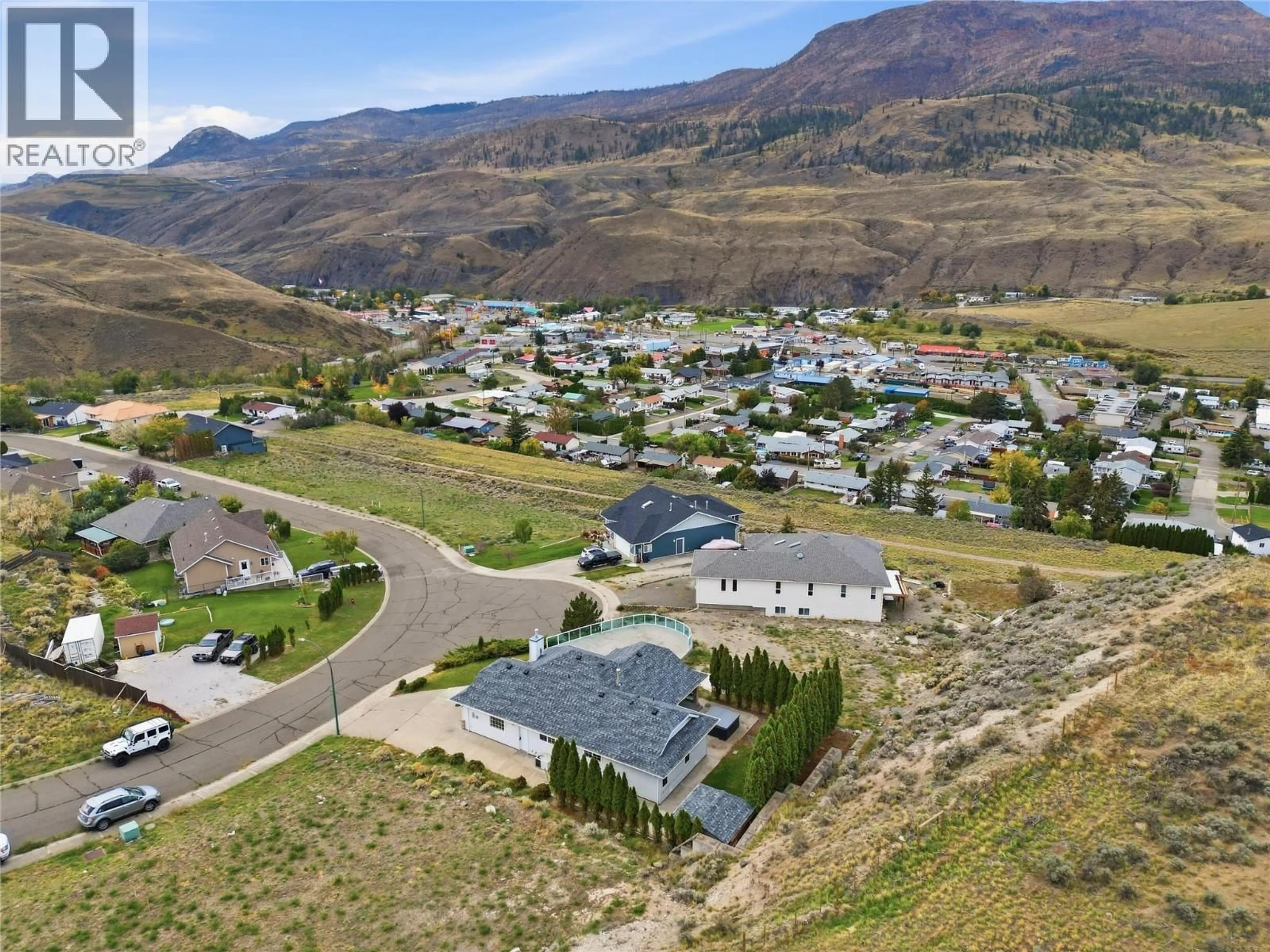 A pic from outside/outdoor area/front of a property/back of a property/a pic from drone, mountain view for 1398/1400 SEMLIN DRIVE, Cache Creek British Columbia V0K1H0