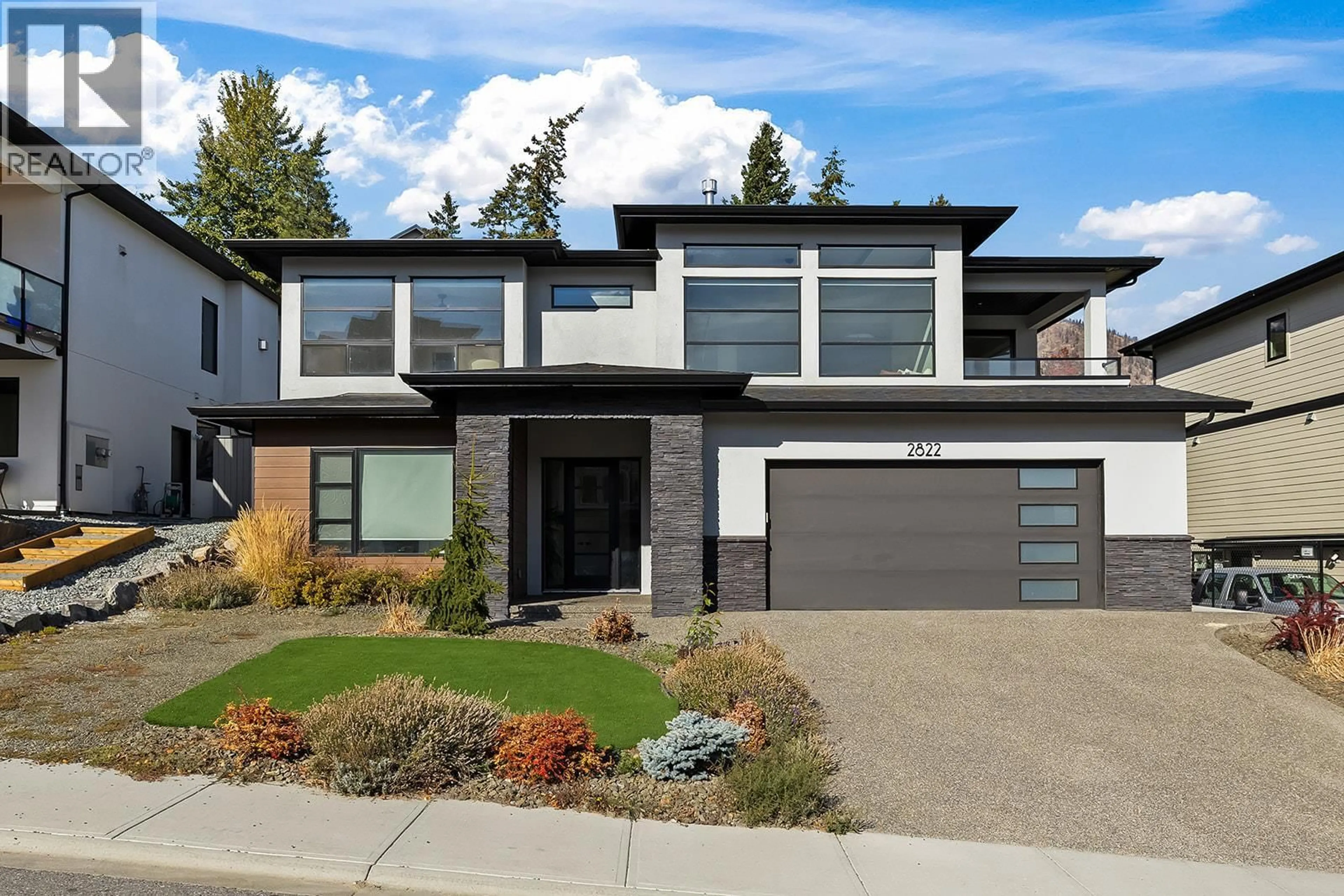Home with brick exterior material, street for 2822 CANYON CREST DRIVE, West Kelowna British Columbia V4T3A6