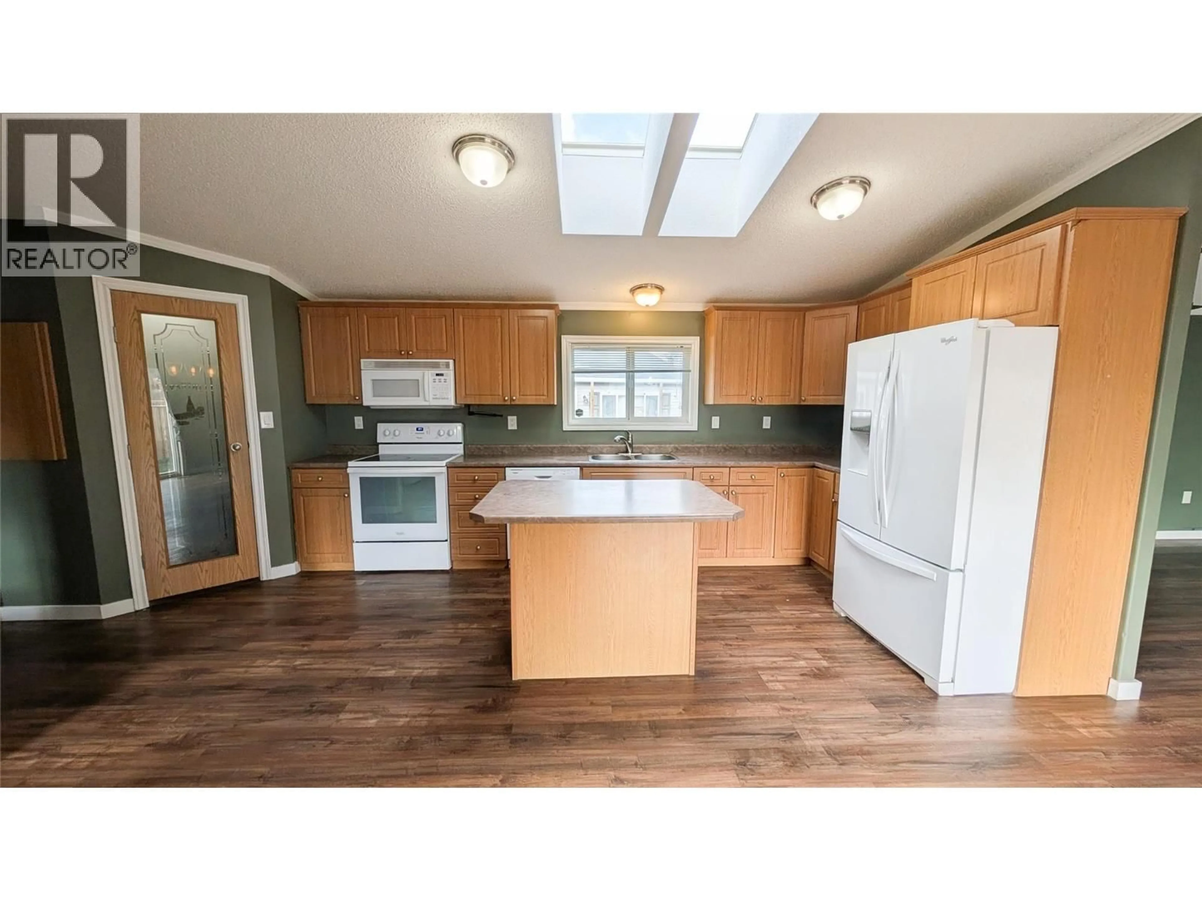 Open concept kitchen, wood/laminate floor for 4811 CRESCENTWOOD DRIVE, Edgewater British Columbia V0A1E0