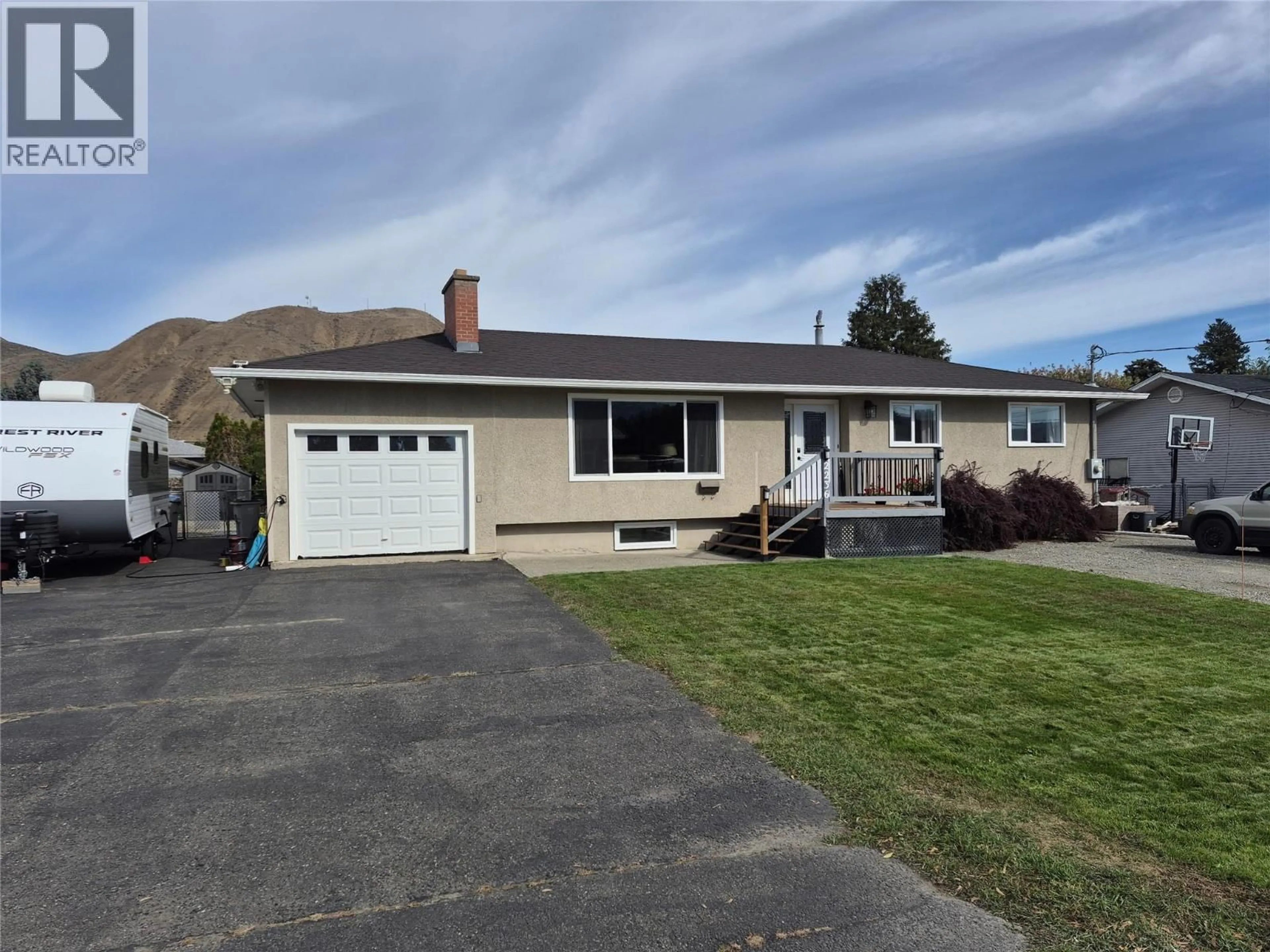 Home with vinyl exterior material, street for 2236 GREENFIELD AVENUE, Kamloops British Columbia V2B4P3