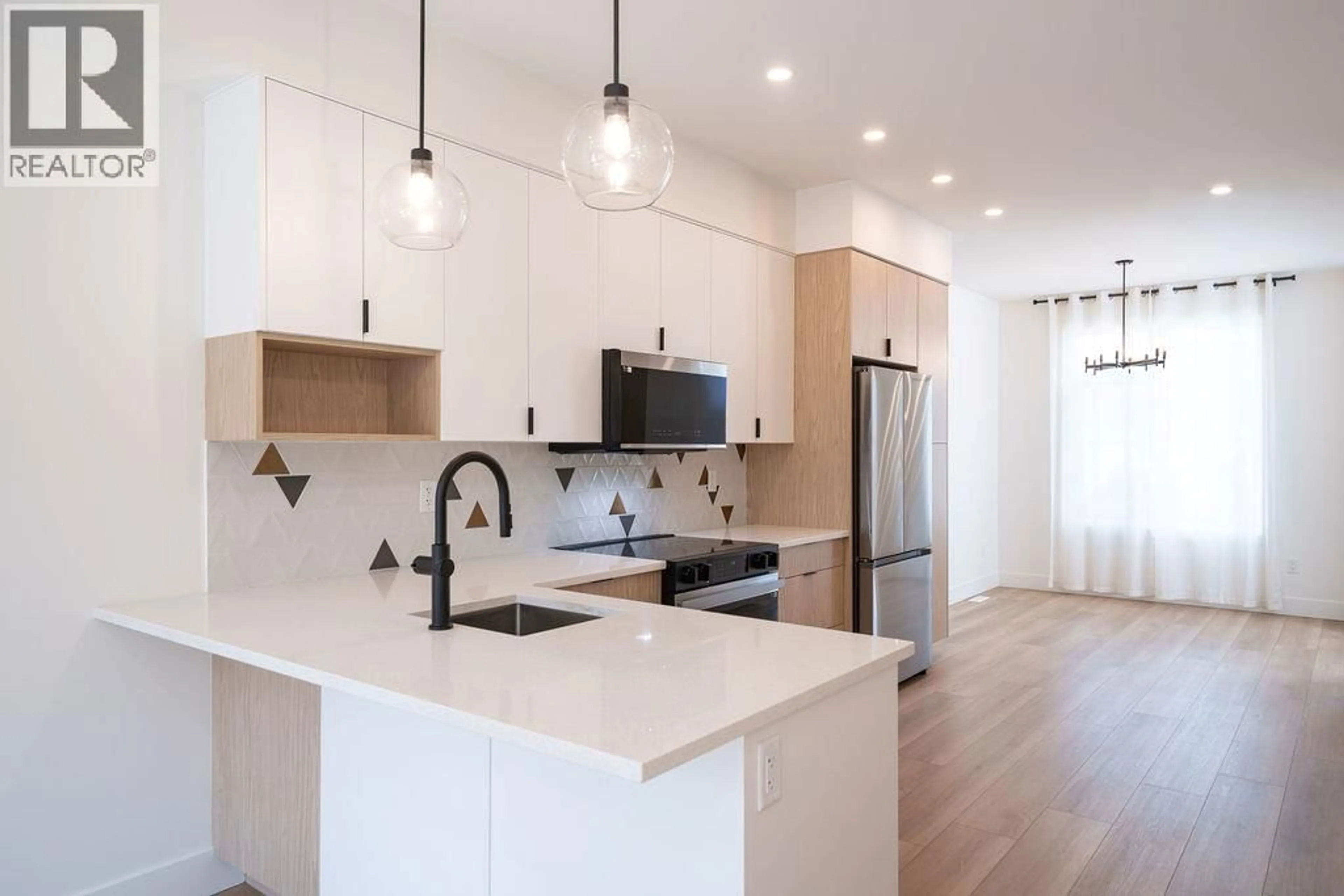 Open concept kitchen, wood/laminate floor for 4 - 414 HUMBERT STREET, Revelstoke British Columbia V0E2S0