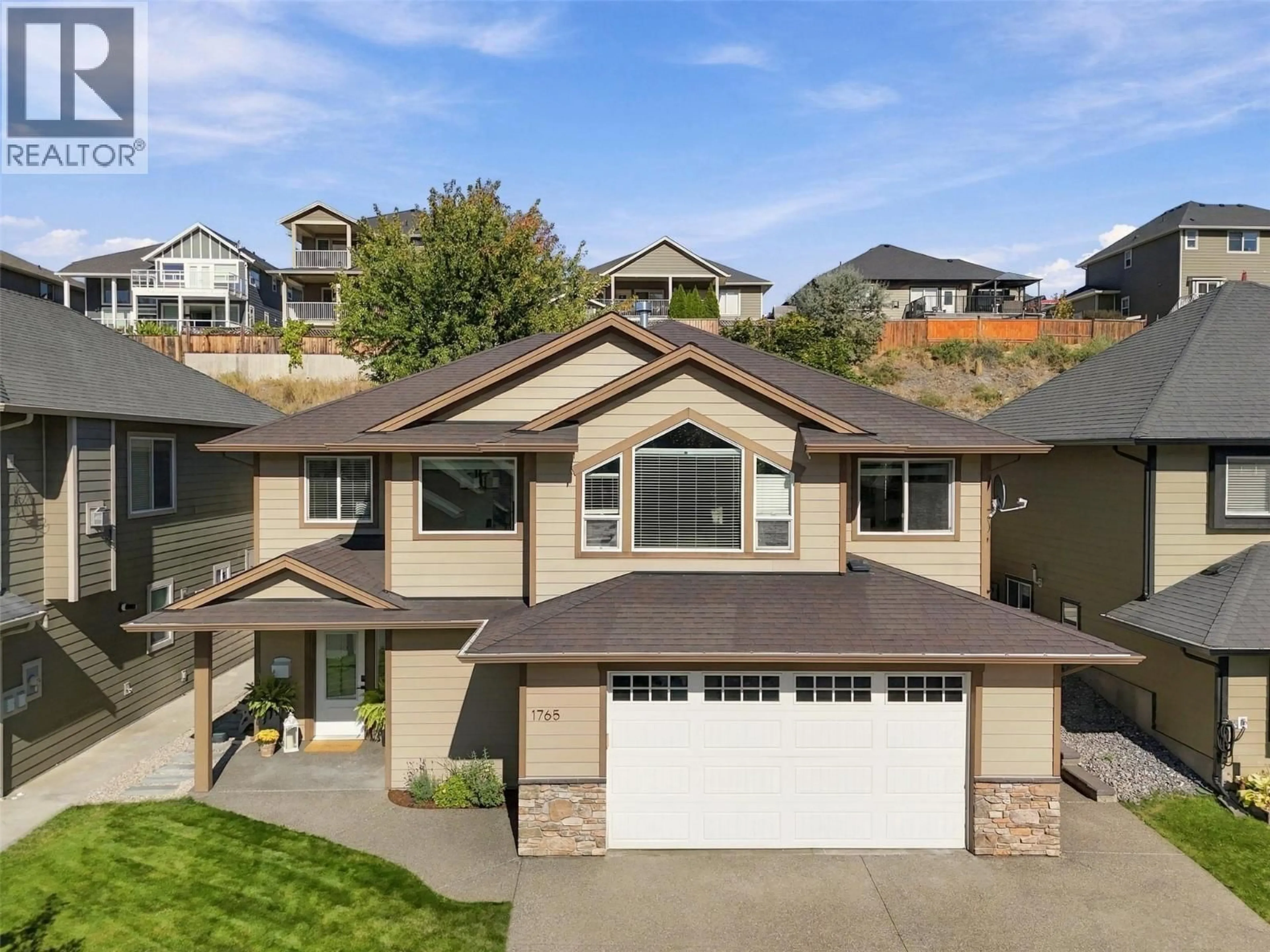 A pic from outside/outdoor area/front of a property/back of a property/a pic from drone, mountain view for 1765 FOXTAIL DRIVE, Kamloops British Columbia V1S0B1
