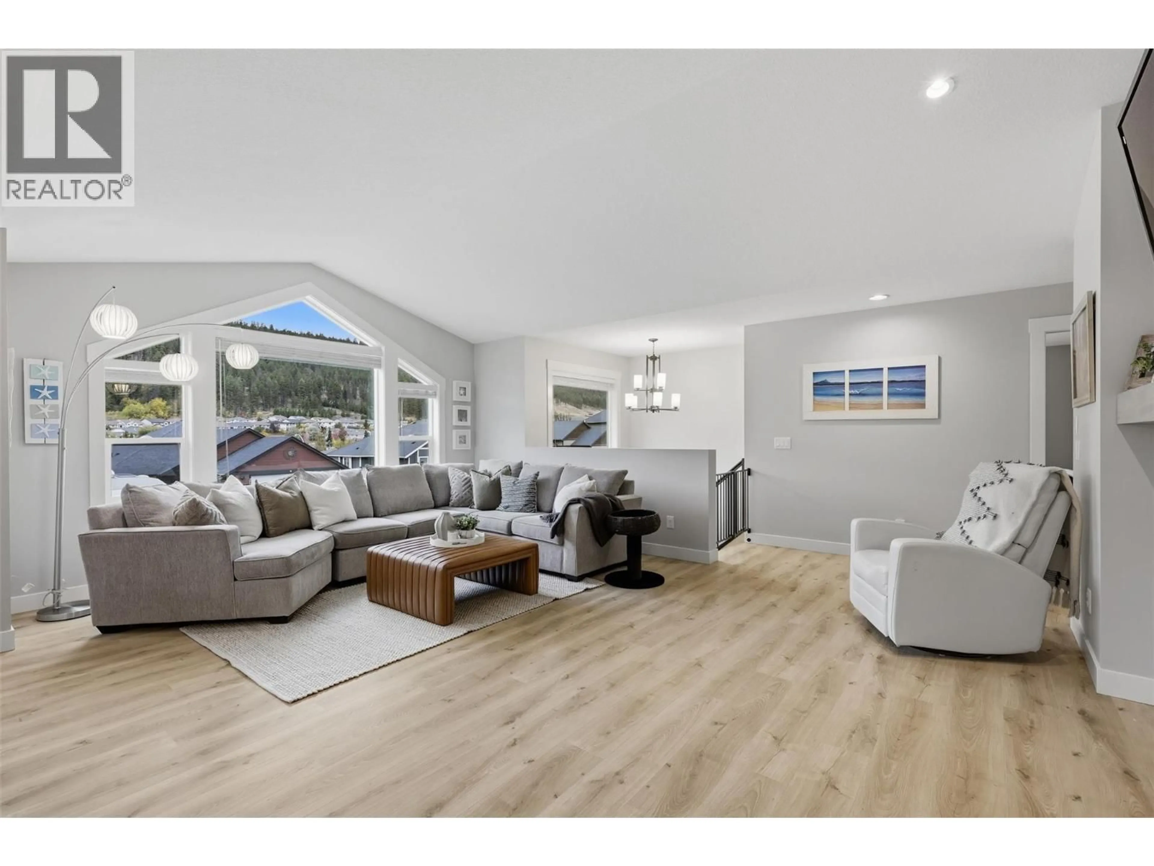 Living room with furniture, wood/laminate floor for 1765 FOXTAIL DRIVE, Kamloops British Columbia V1S0B1