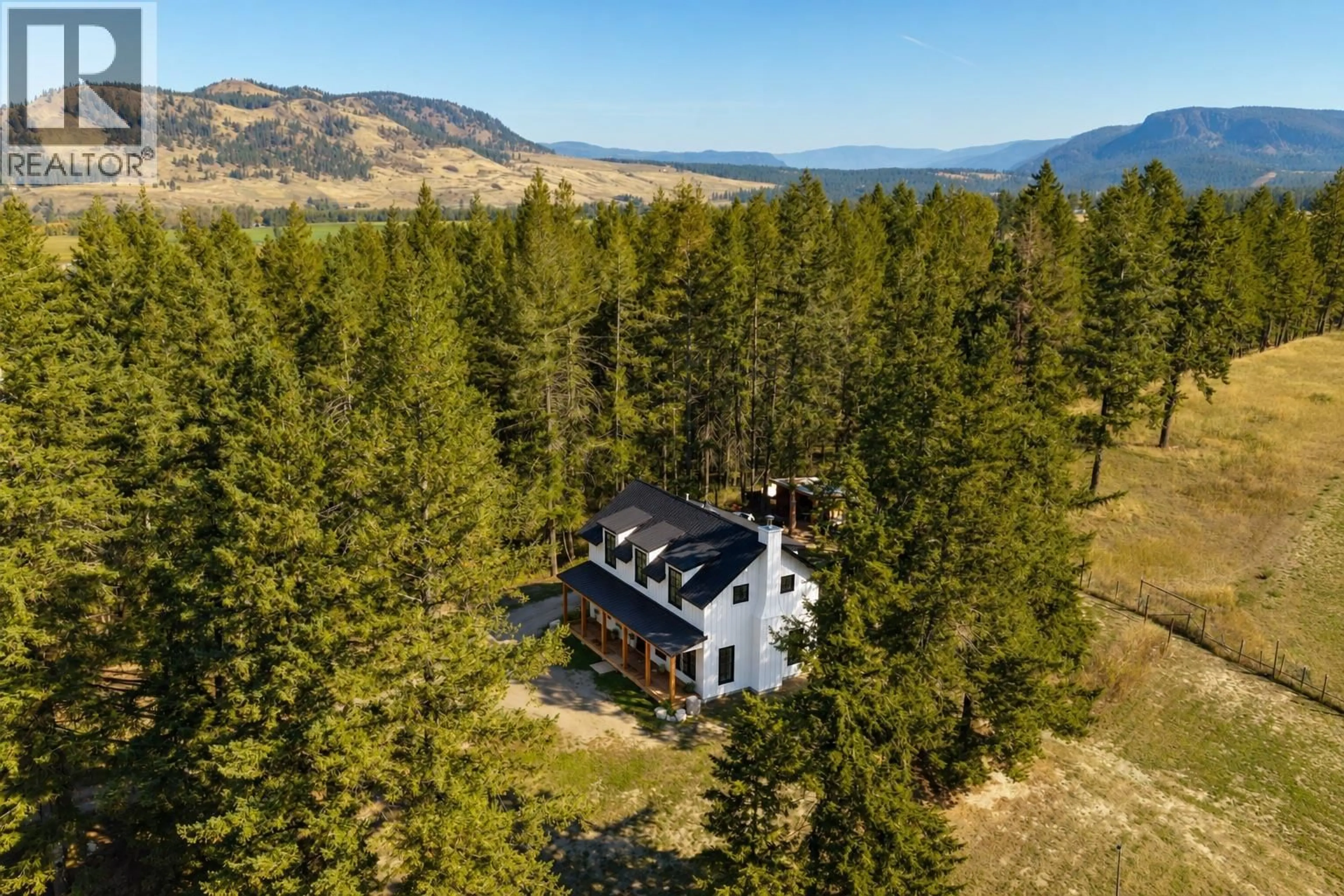 A pic from outside/outdoor area/front of a property/back of a property/a pic from drone, mountain view for 96 BLOOM ROAD, Lumby British Columbia V0E2G7
