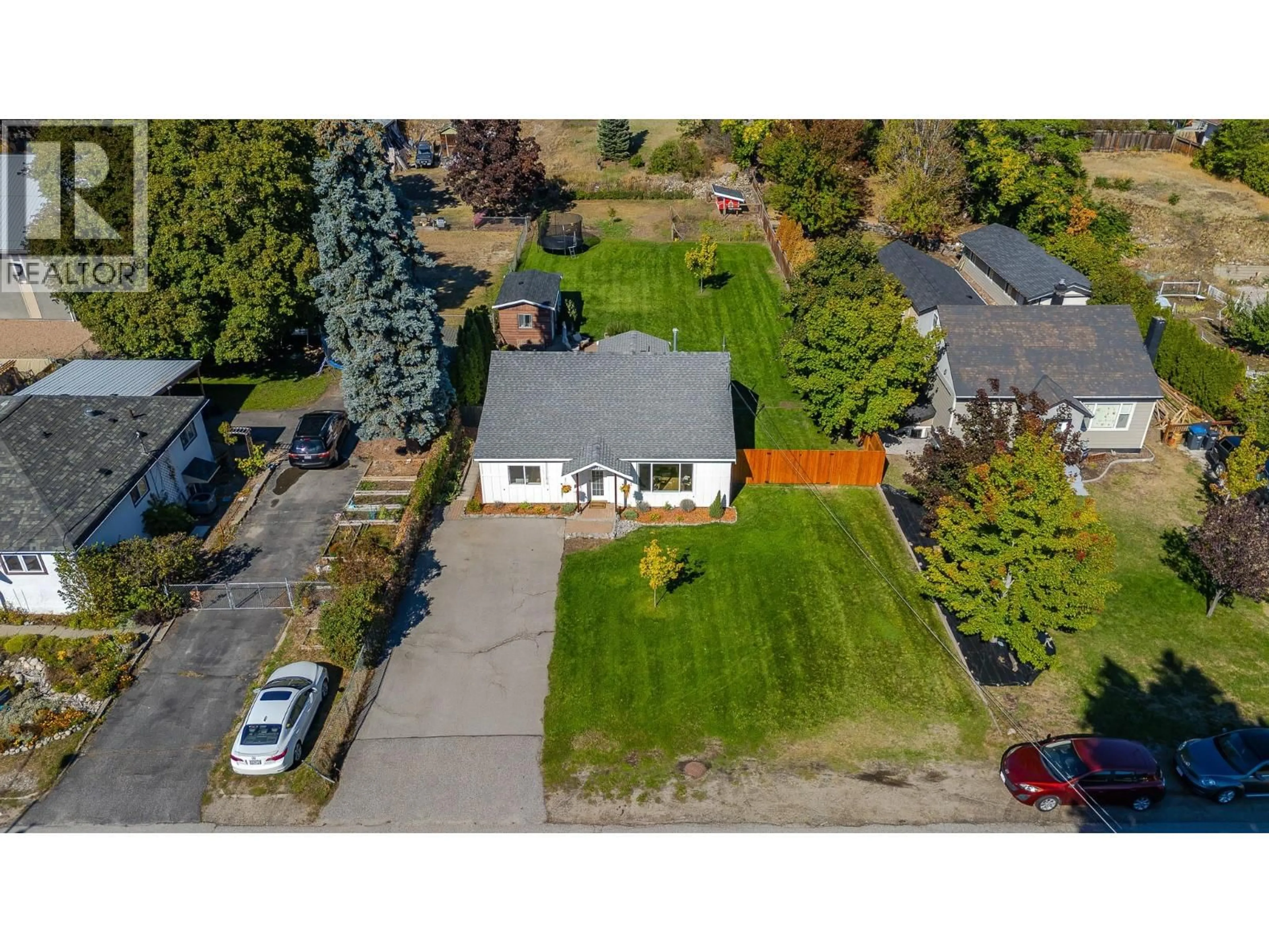 A pic from outside/outdoor area/front of a property/back of a property/a pic from drone, street for 9722 JULIA STREET, Summerland British Columbia V0H1Z5