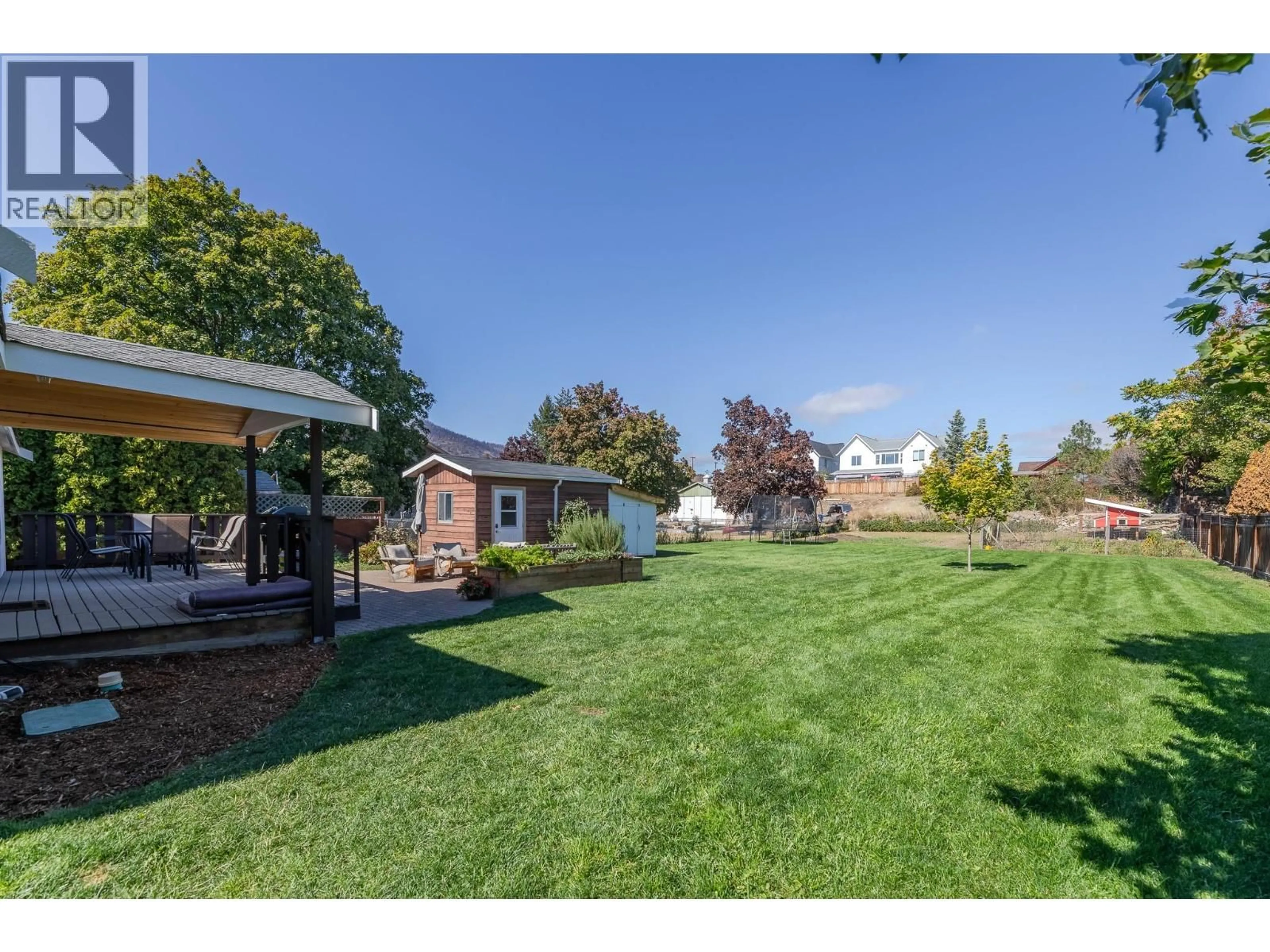 A pic from outside/outdoor area/front of a property/back of a property/a pic from drone, unknown for 9722 JULIA STREET, Summerland British Columbia V0H1Z5