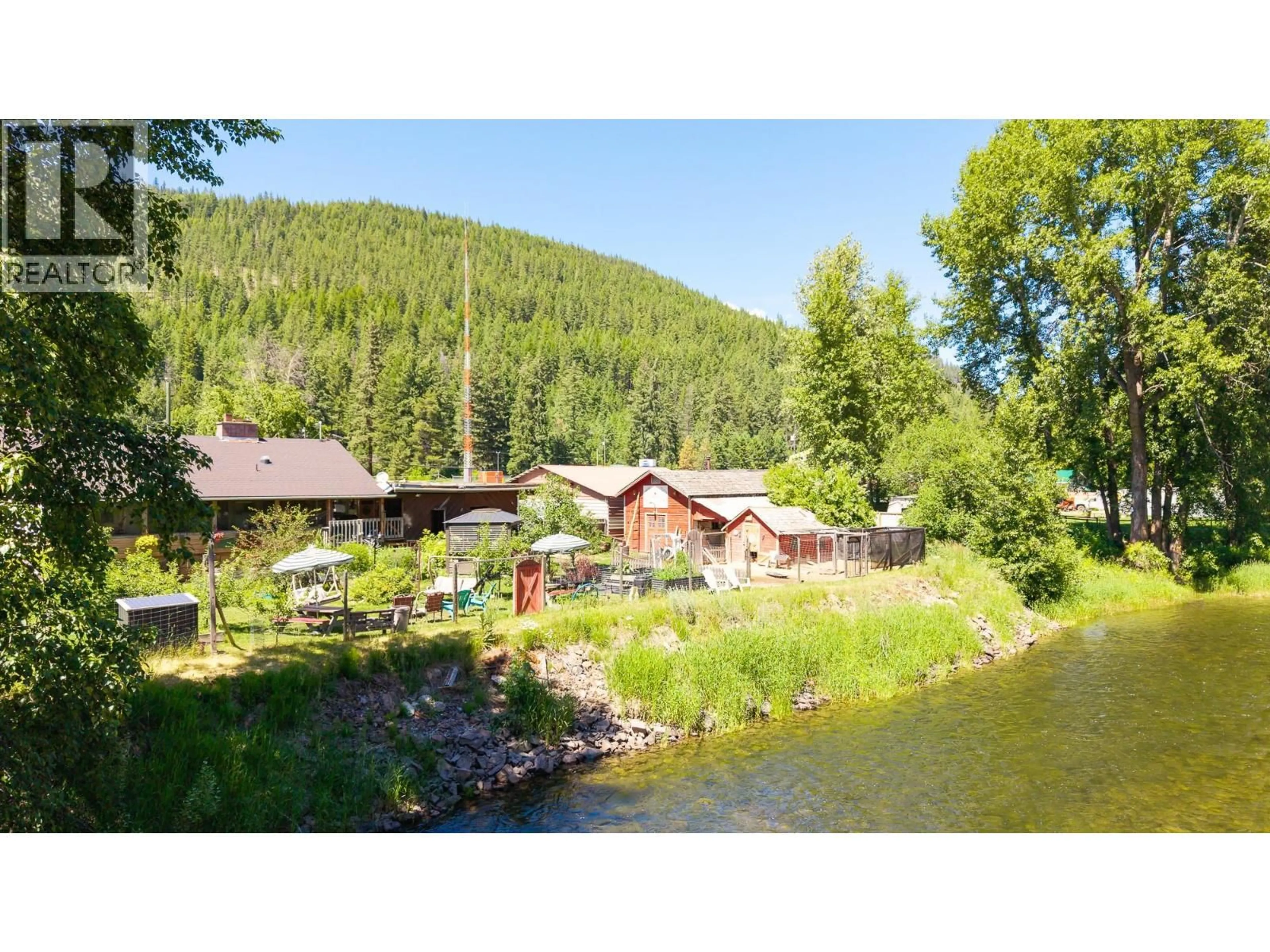 A pic from outside/outdoor area/front of a property/back of a property/a pic from drone, water/lake/river/ocean view for 9005 3 & 95 HIGHWAY, Yahk British Columbia V0B2P0